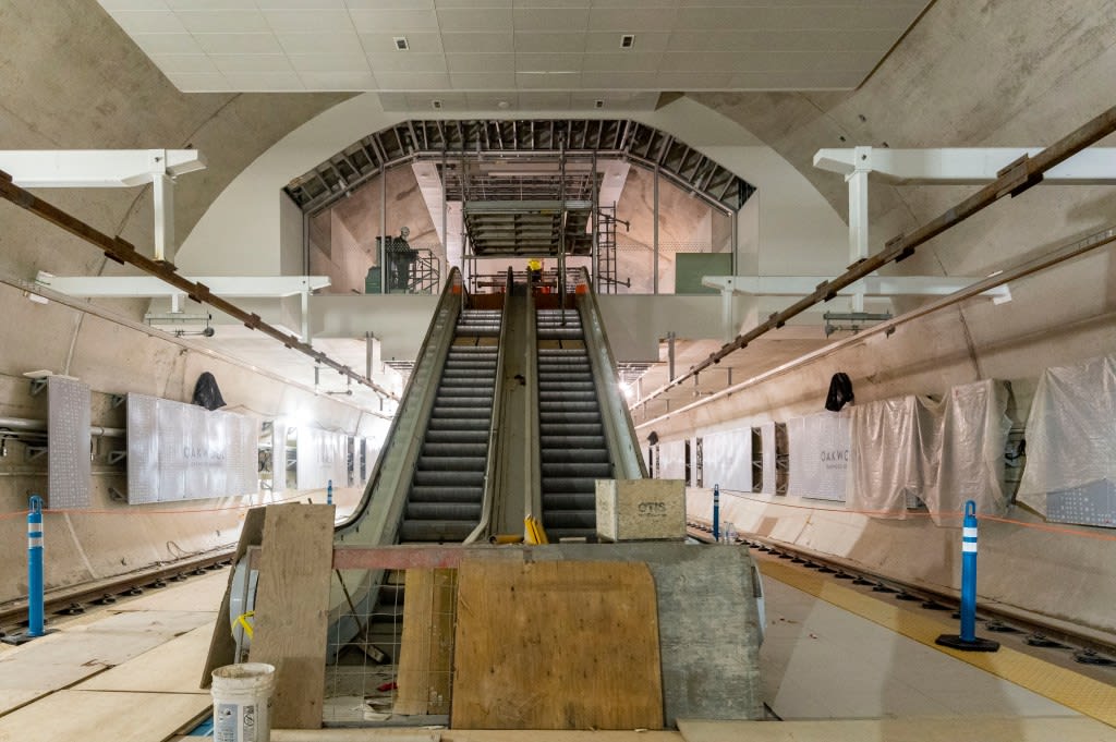 escalators running down to track level.