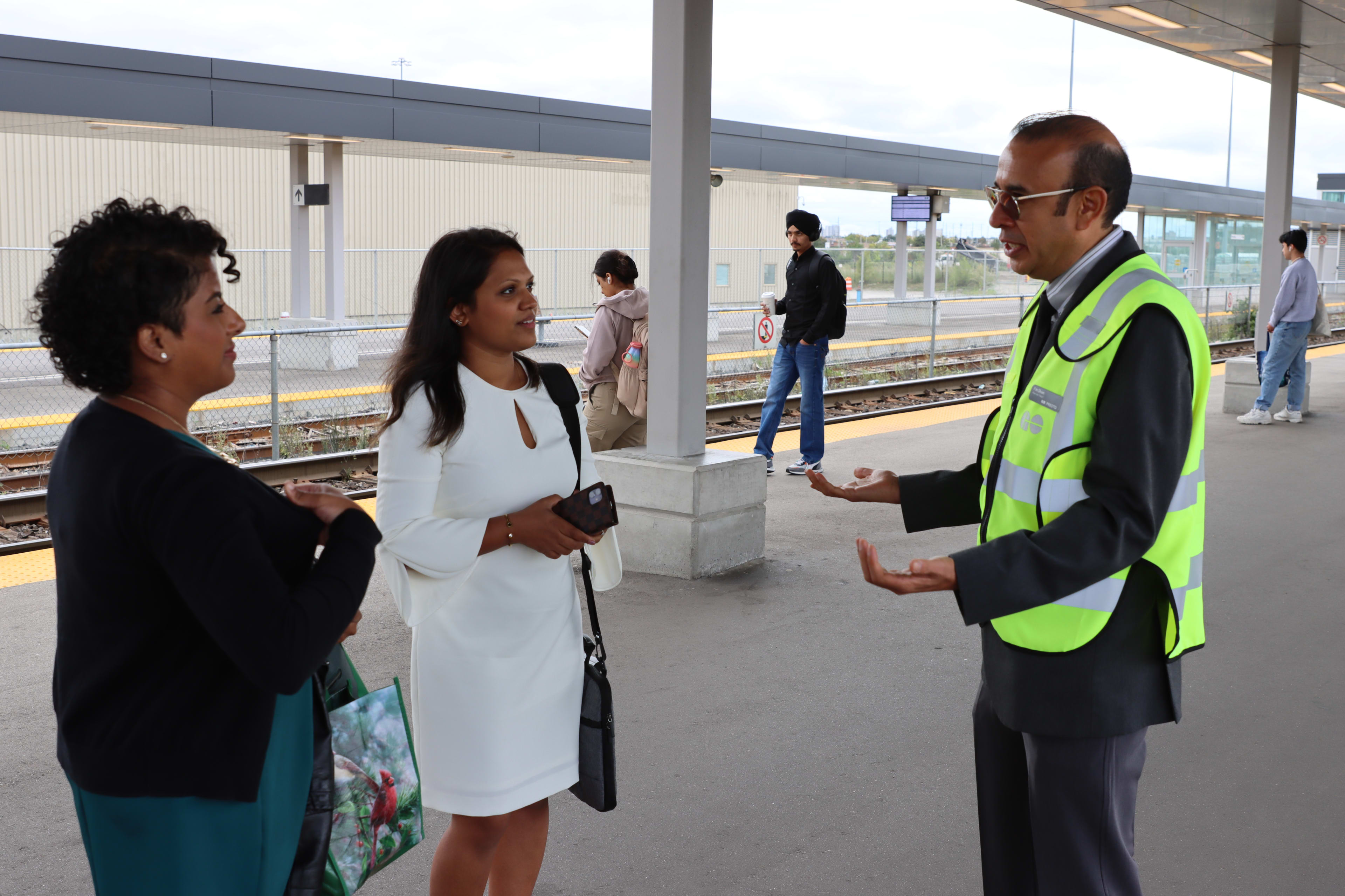 Shahnawaz Rasul, a station ambassador, speaks with customers in Bramalea.