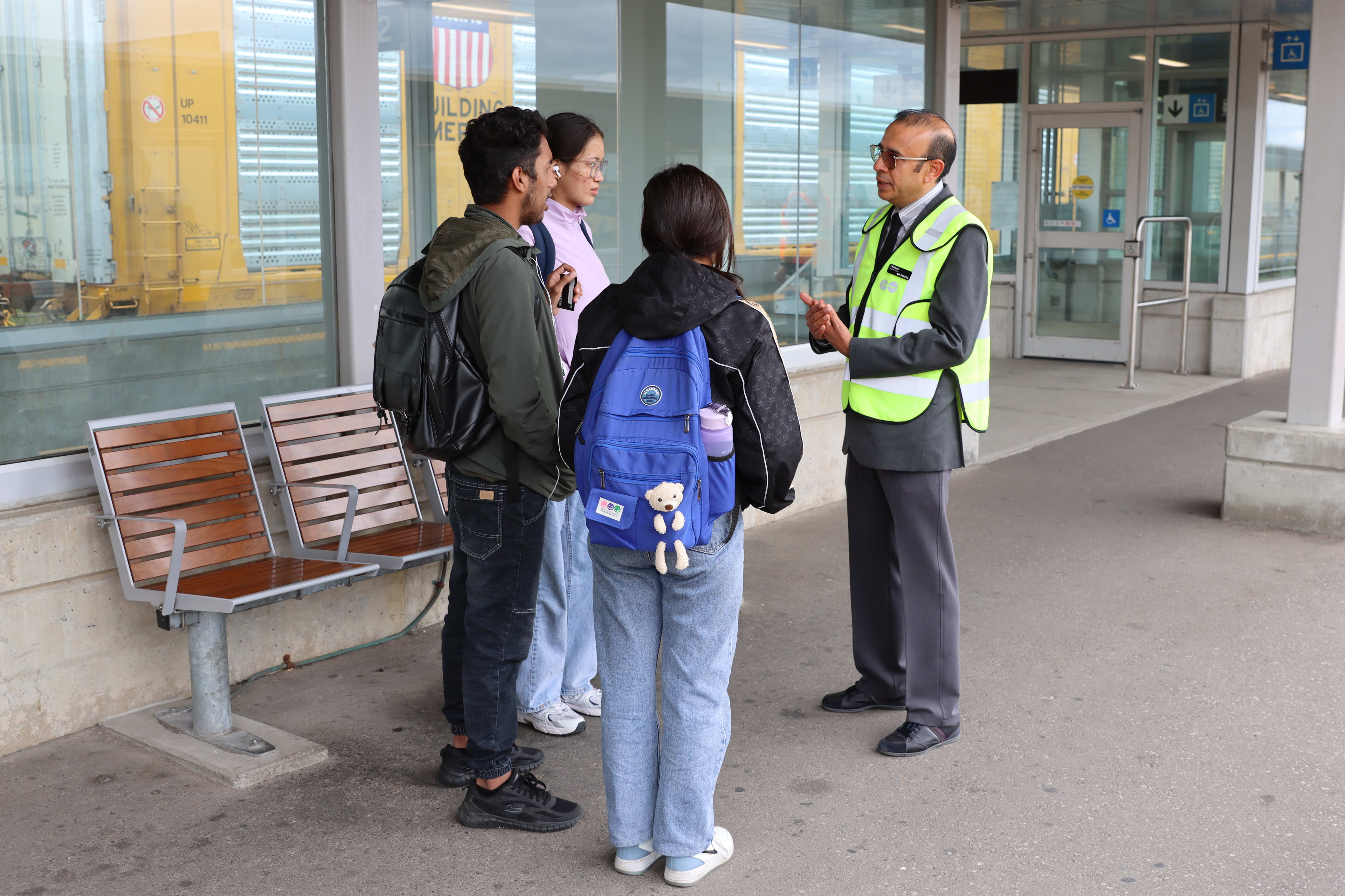 Station Ambassador Shahnawaz Rasul speaks to customers at Bramalea GO.