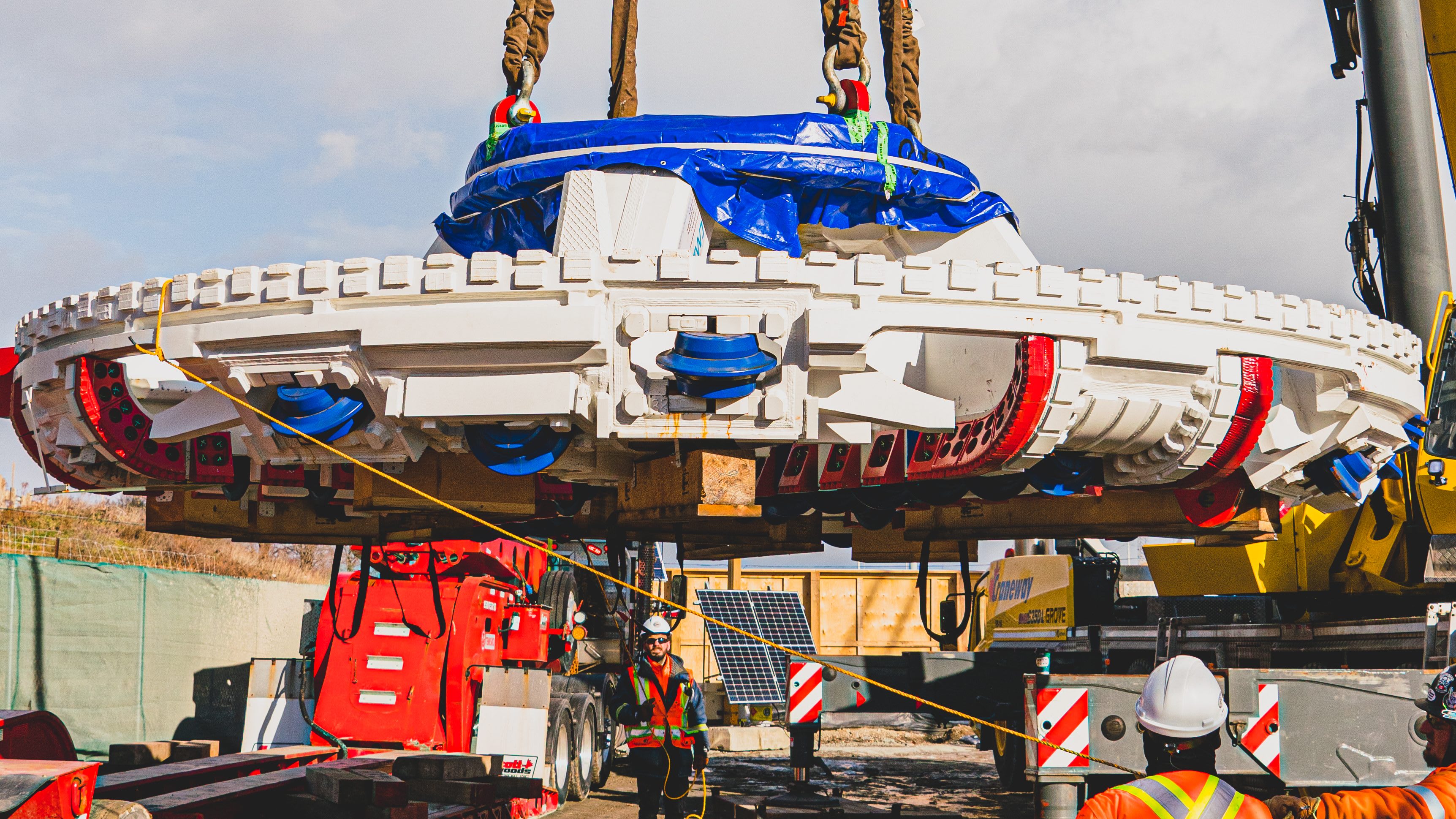 a crane raising the big TBM.