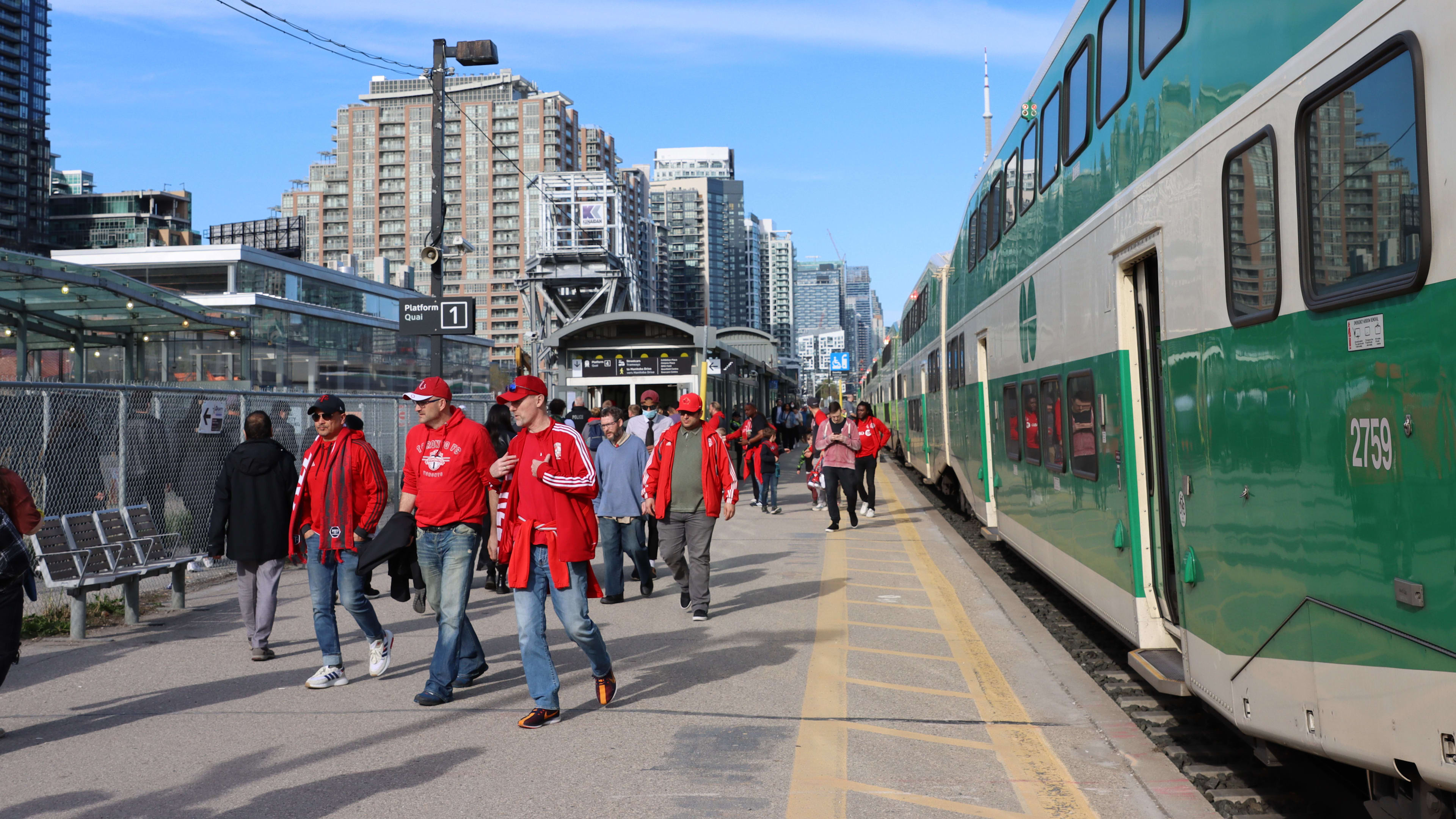 TFC fans disembark from train and head towards Liberty Village