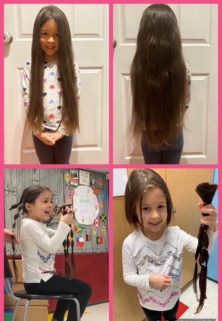A child holds up her trimmed hair.