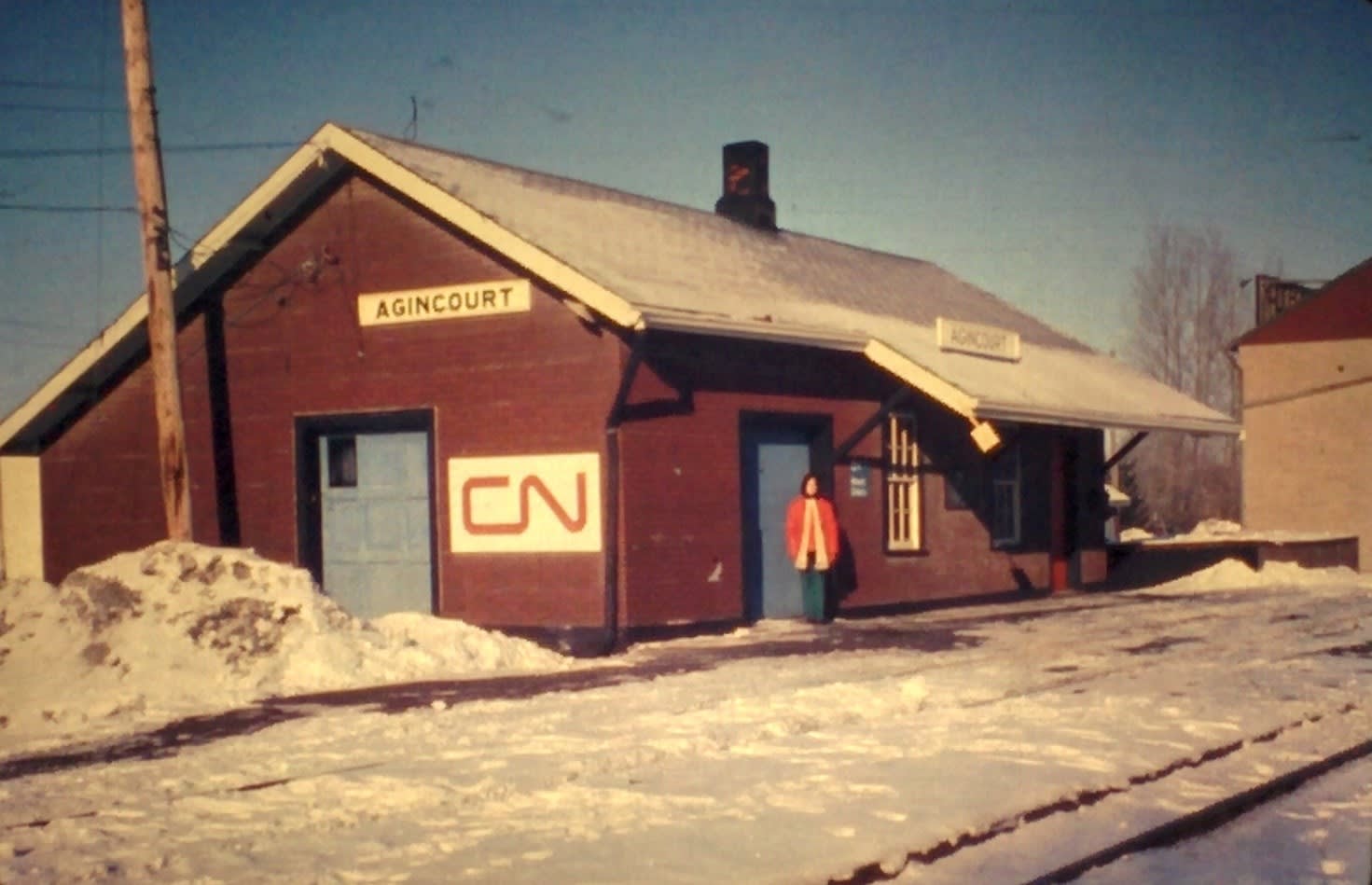 Cheryl Preston standing in front of the old CN owned Agincourt train station