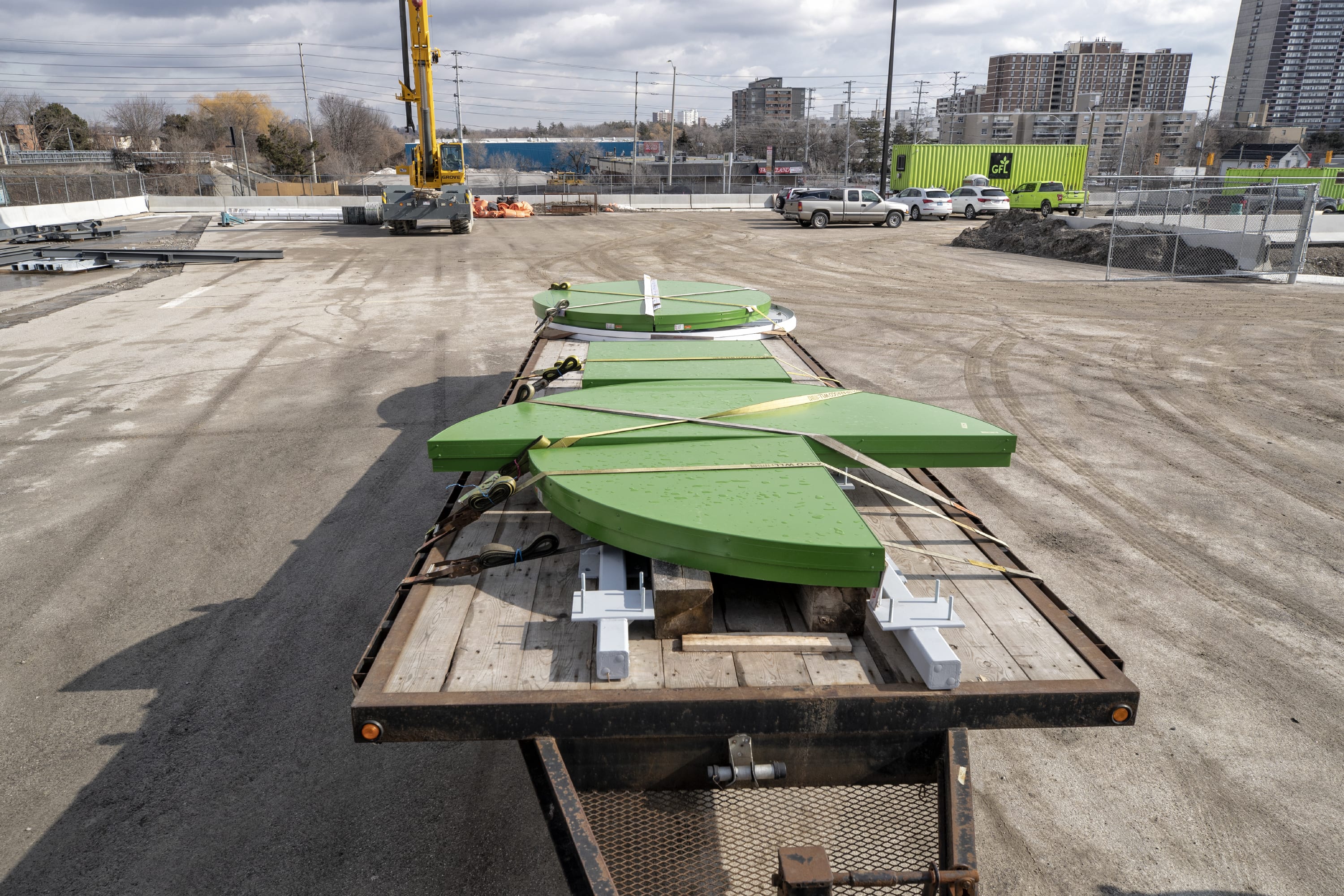The iconic green GO letters sit on a flatbed truck waiting to be installed.