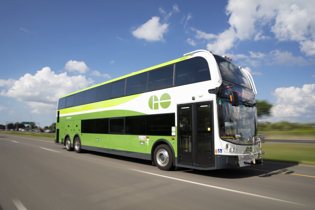 A bus is shown on a highway.