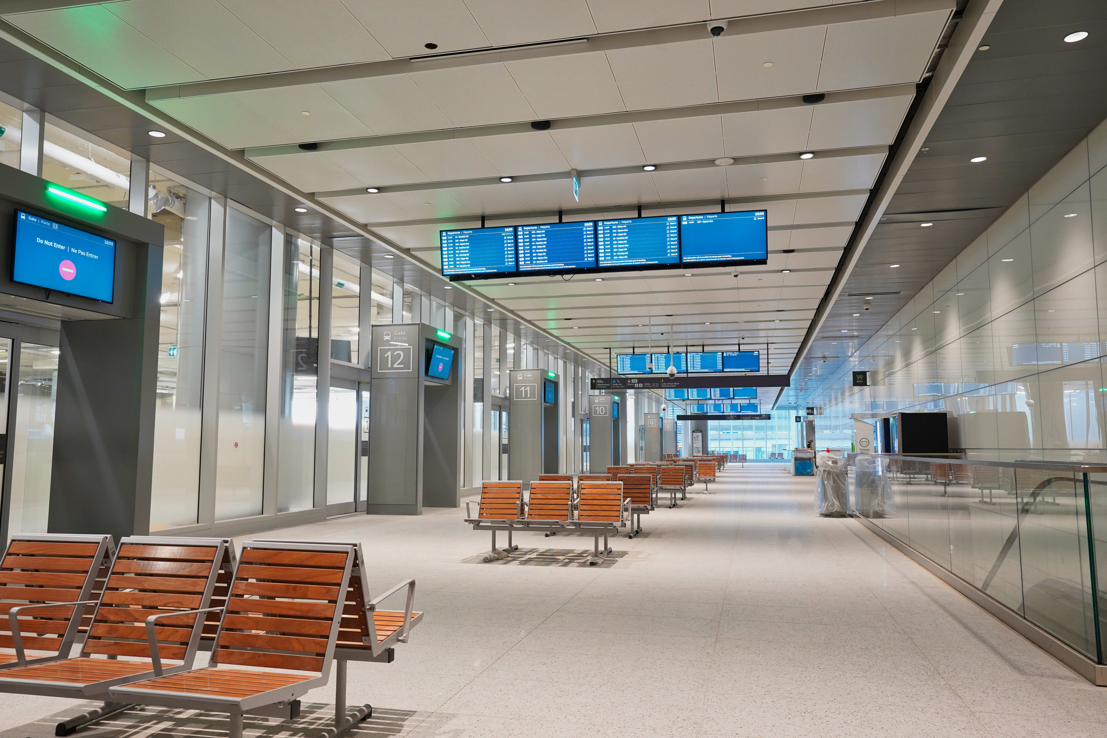 Interior of the new bus terminal with departure gates and benches and screens