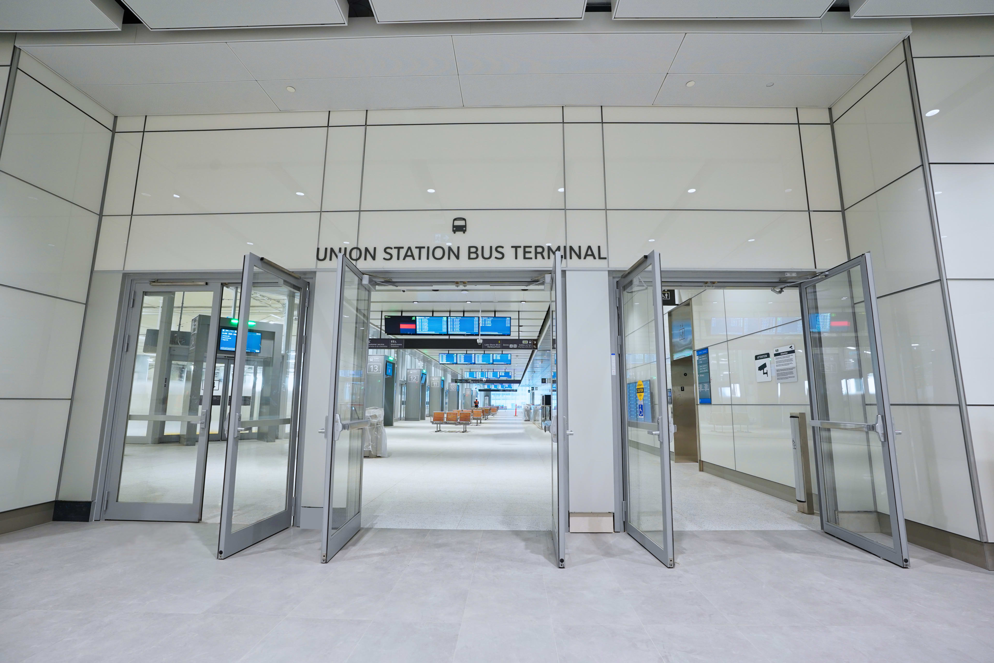 the doors open at the new bus terminal with the Union Station bus terminal sign