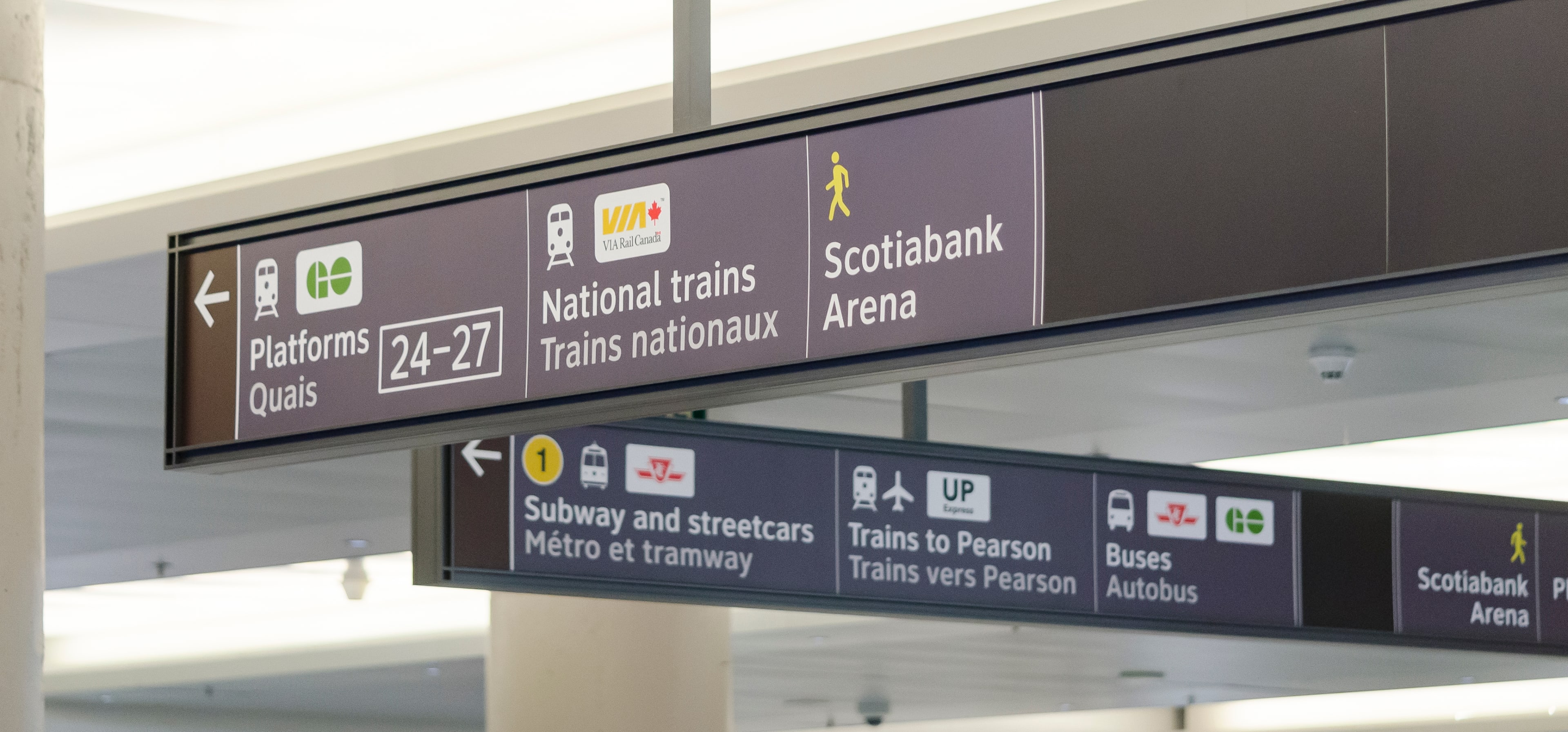 new wayfinding signs inside Union Station showing directions to GO platforms, VIA and TTC