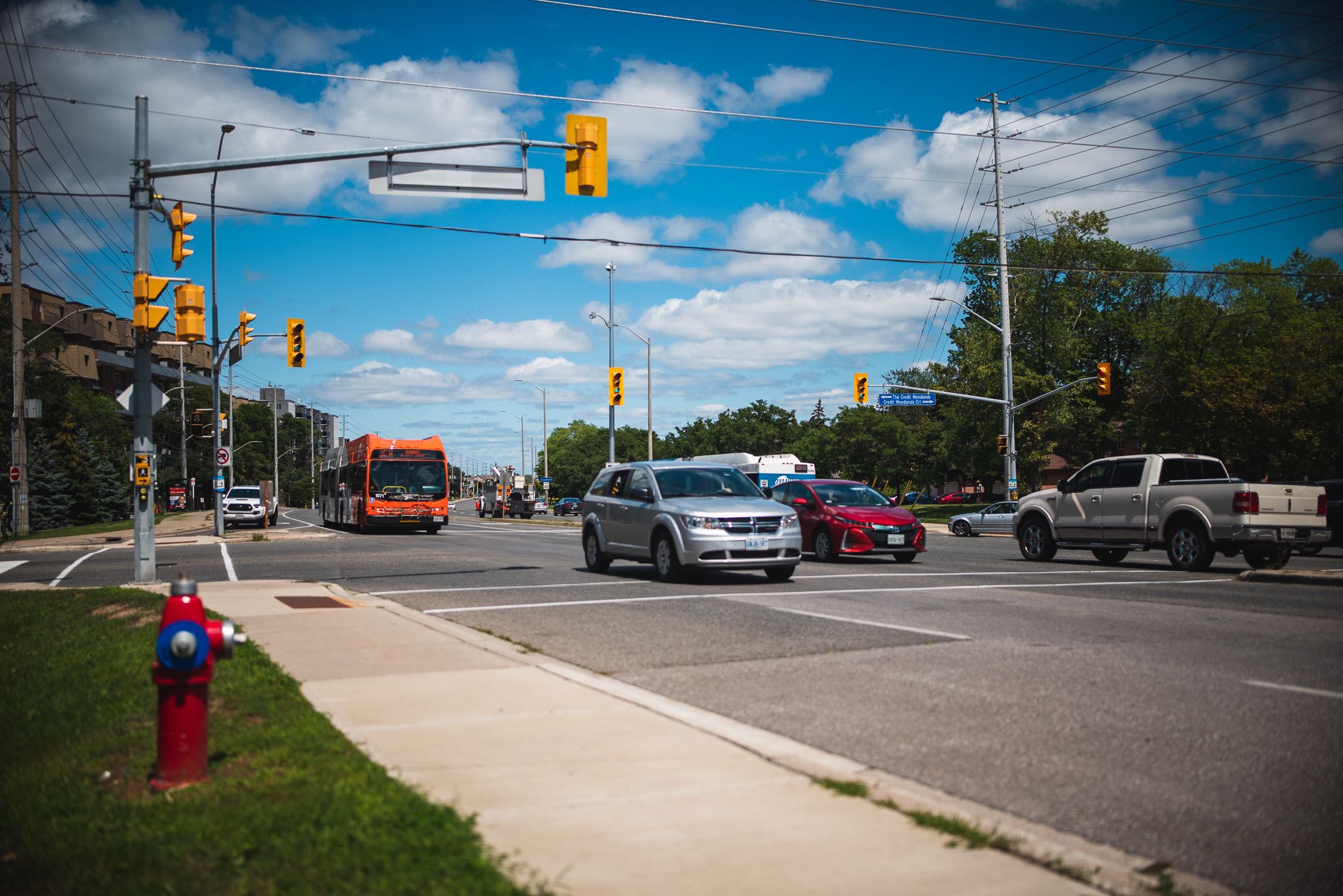 Vehicular traffic travelling westbound on Dundas Street at The Credit Woodlands intersection in M...
