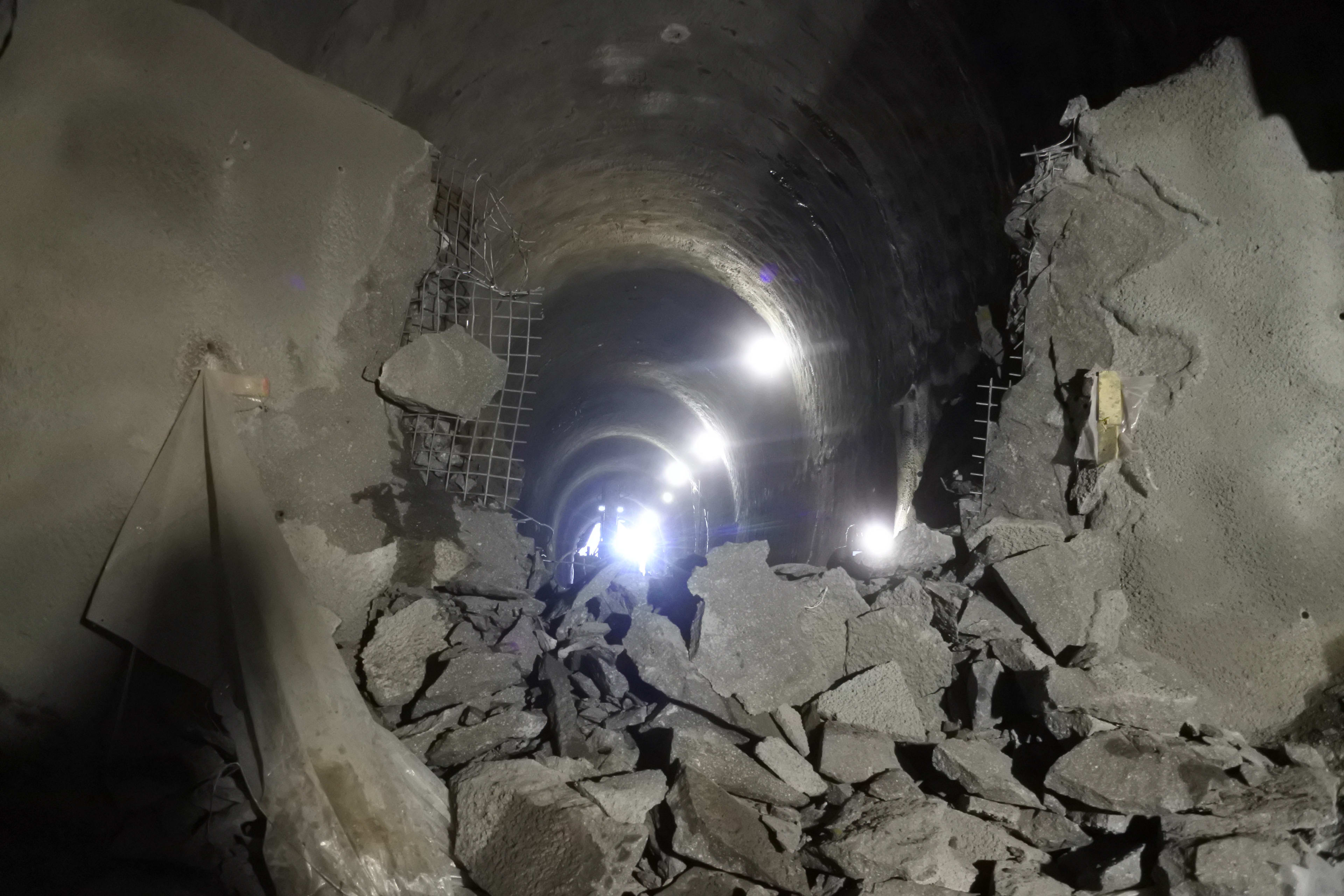 The tunnel is seen with smashed concrete.