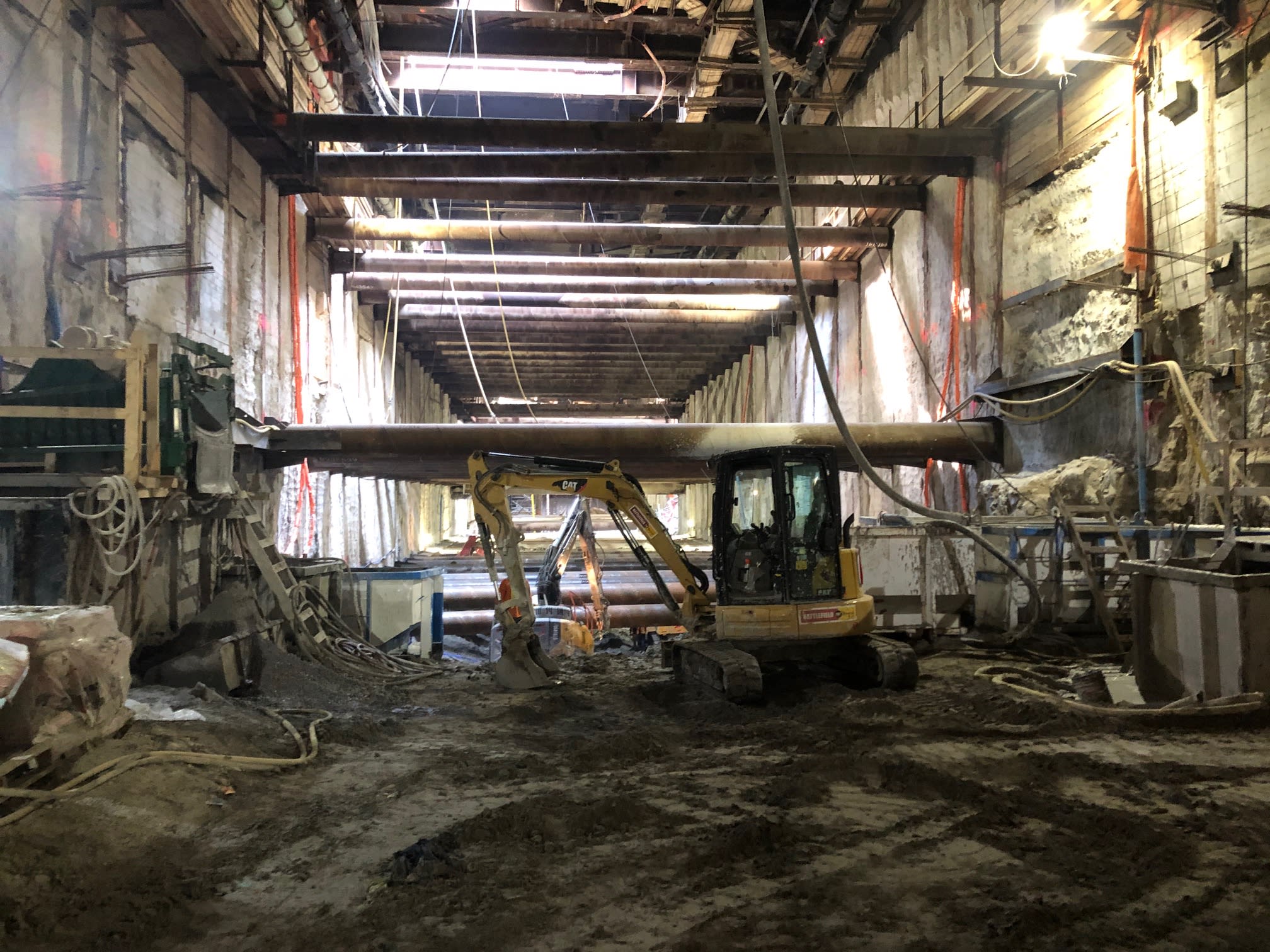 a large tractor inside the station construction area.