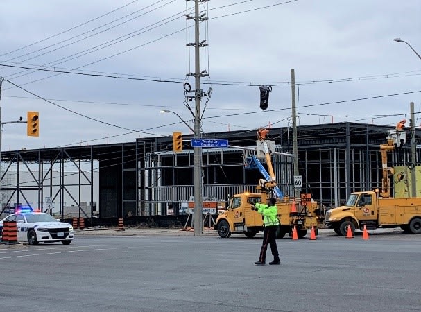 A Peel Regional Police officer patrols an intersection to ensure public safety near active constr...
