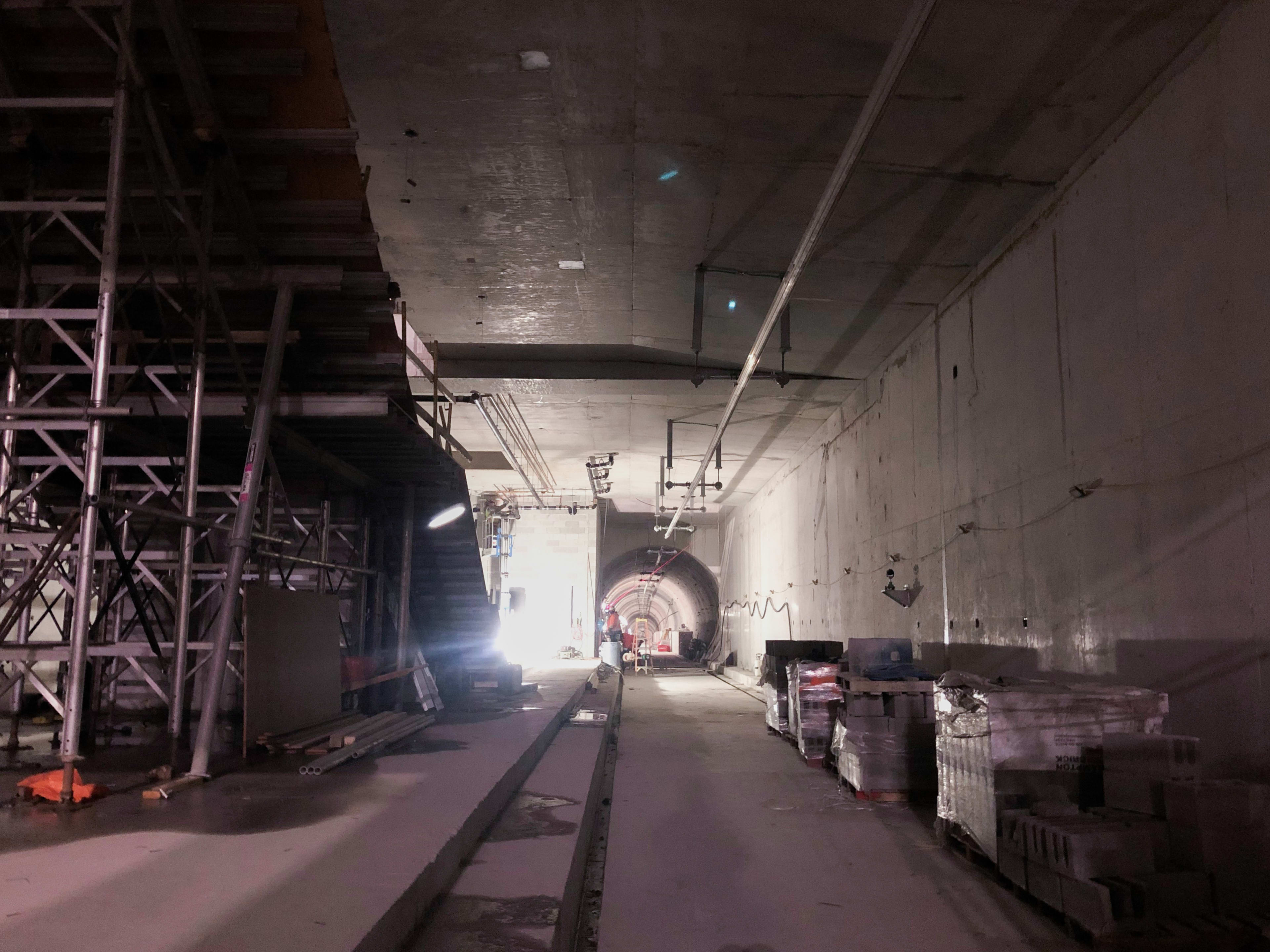 The view inside Fairbank Station with scaffolding and construction workers present