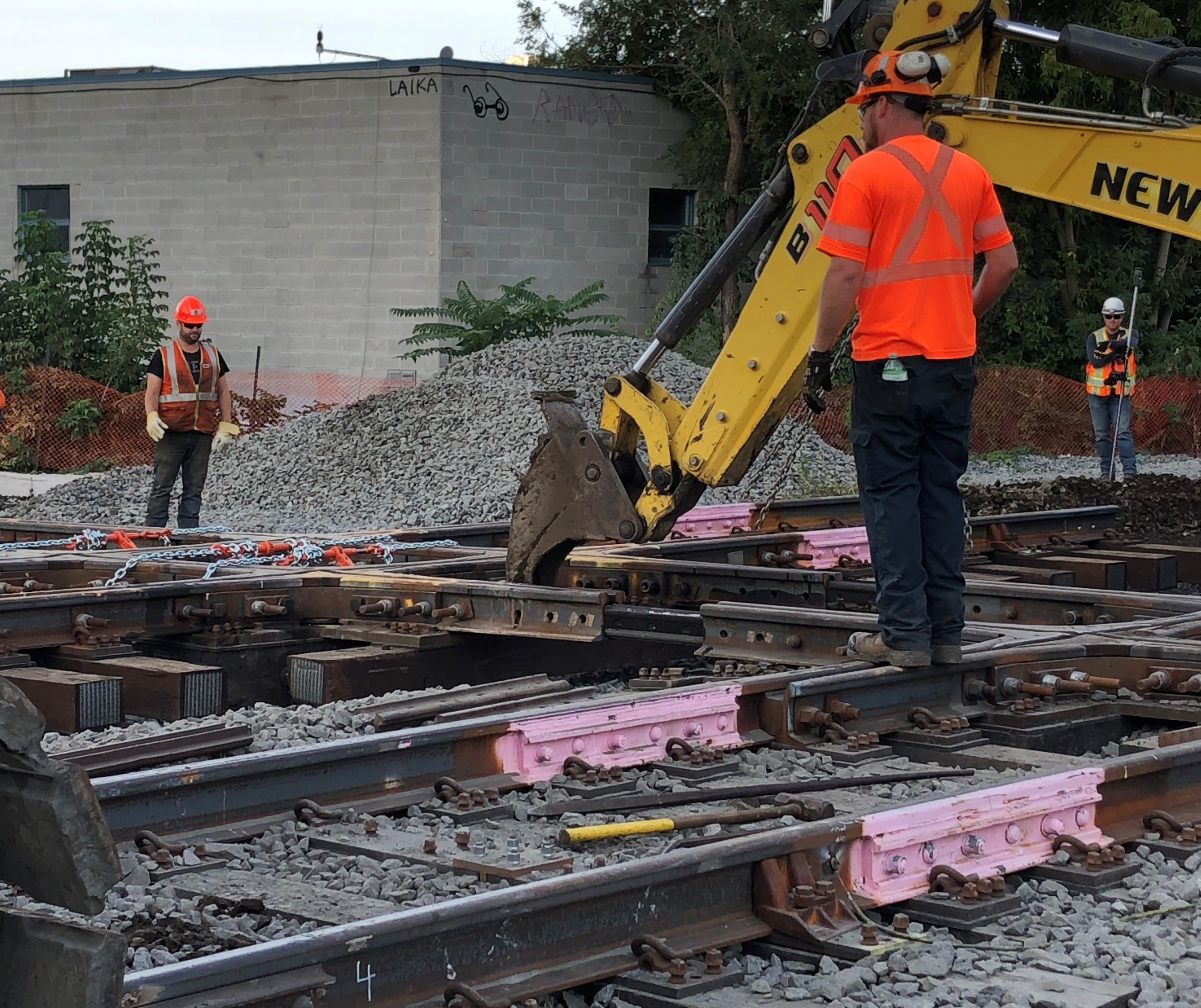 Crews move a section of track.
