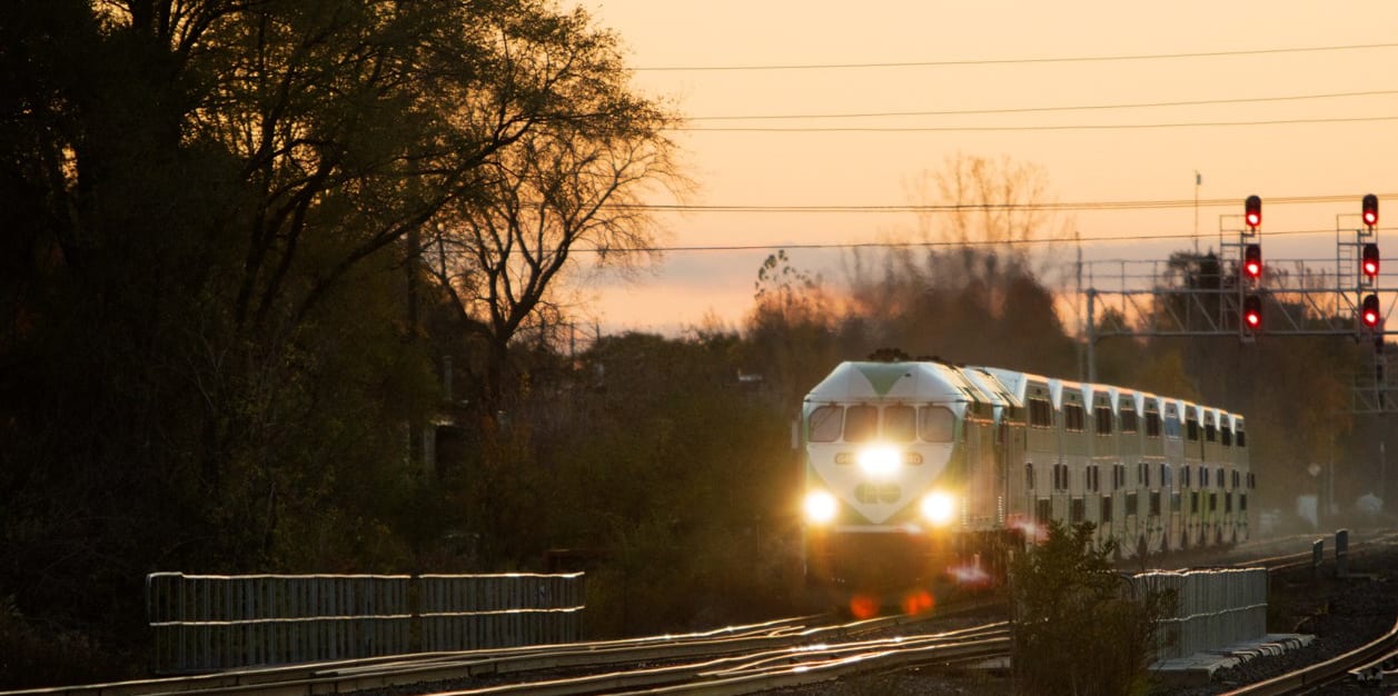 Image of a GO train running along tracks.