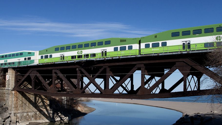 A train moves across a bridge.