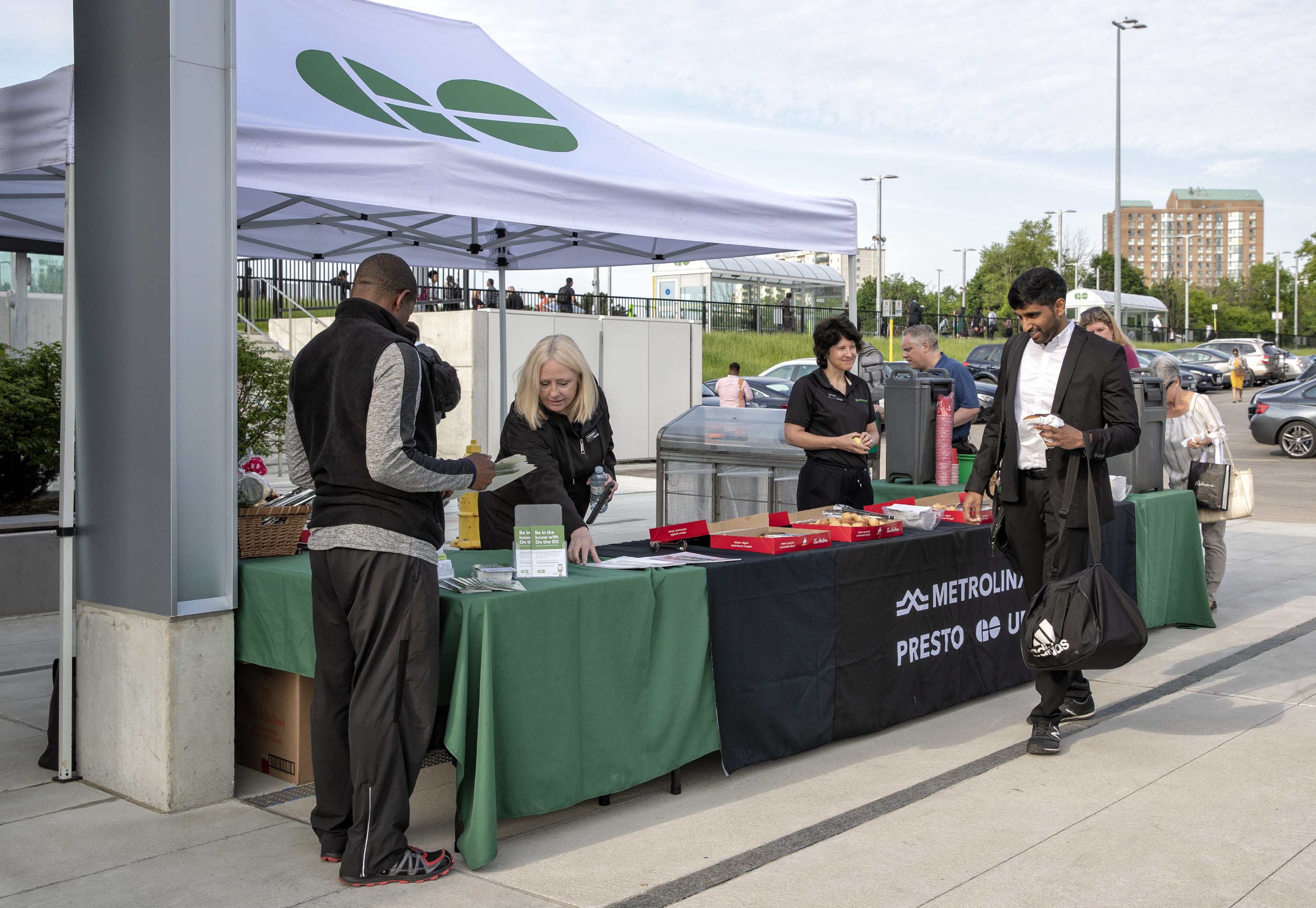 Customers are welcomed to Guildwood GO by community relations staff.
