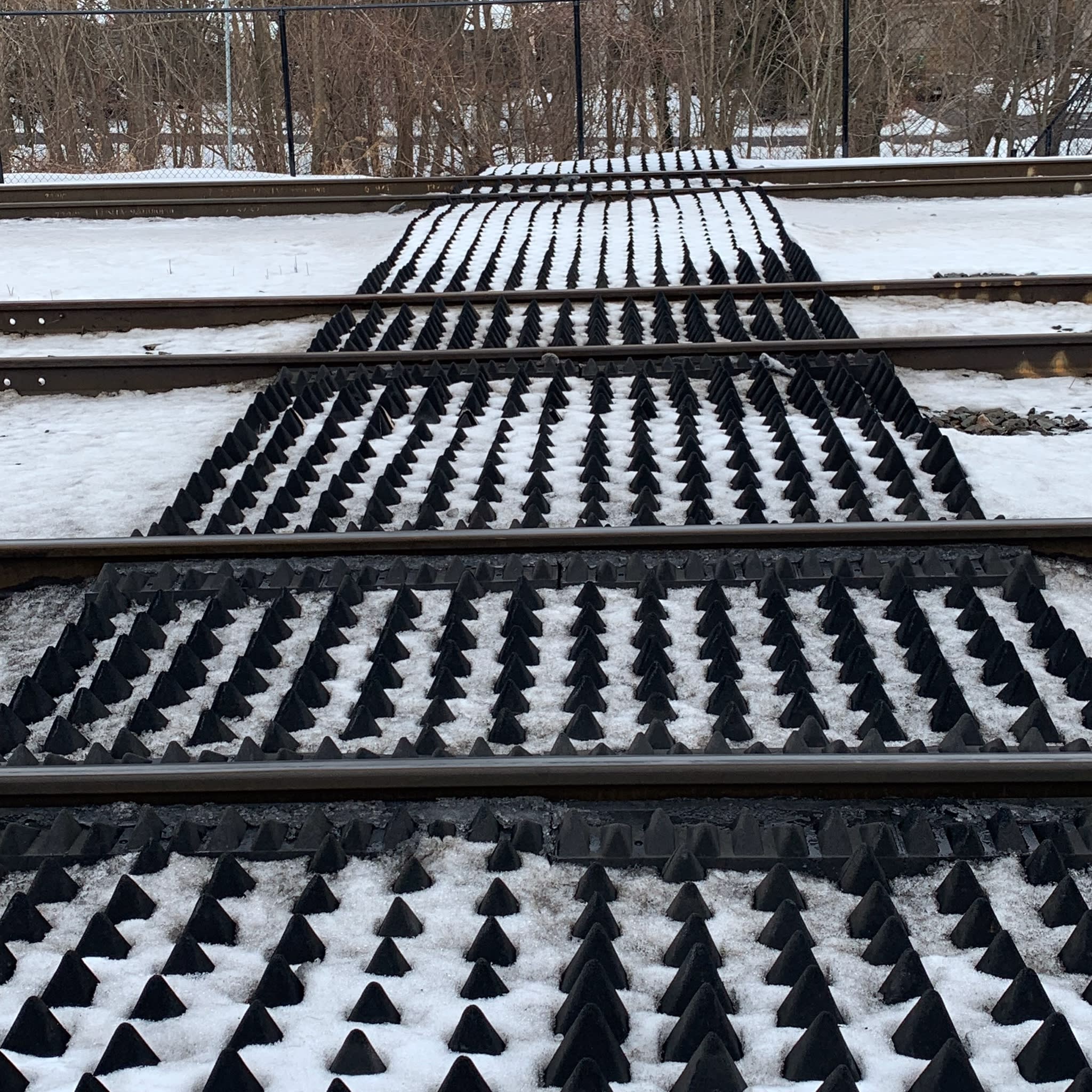 A the rubber safety panels laying next to the tracks
