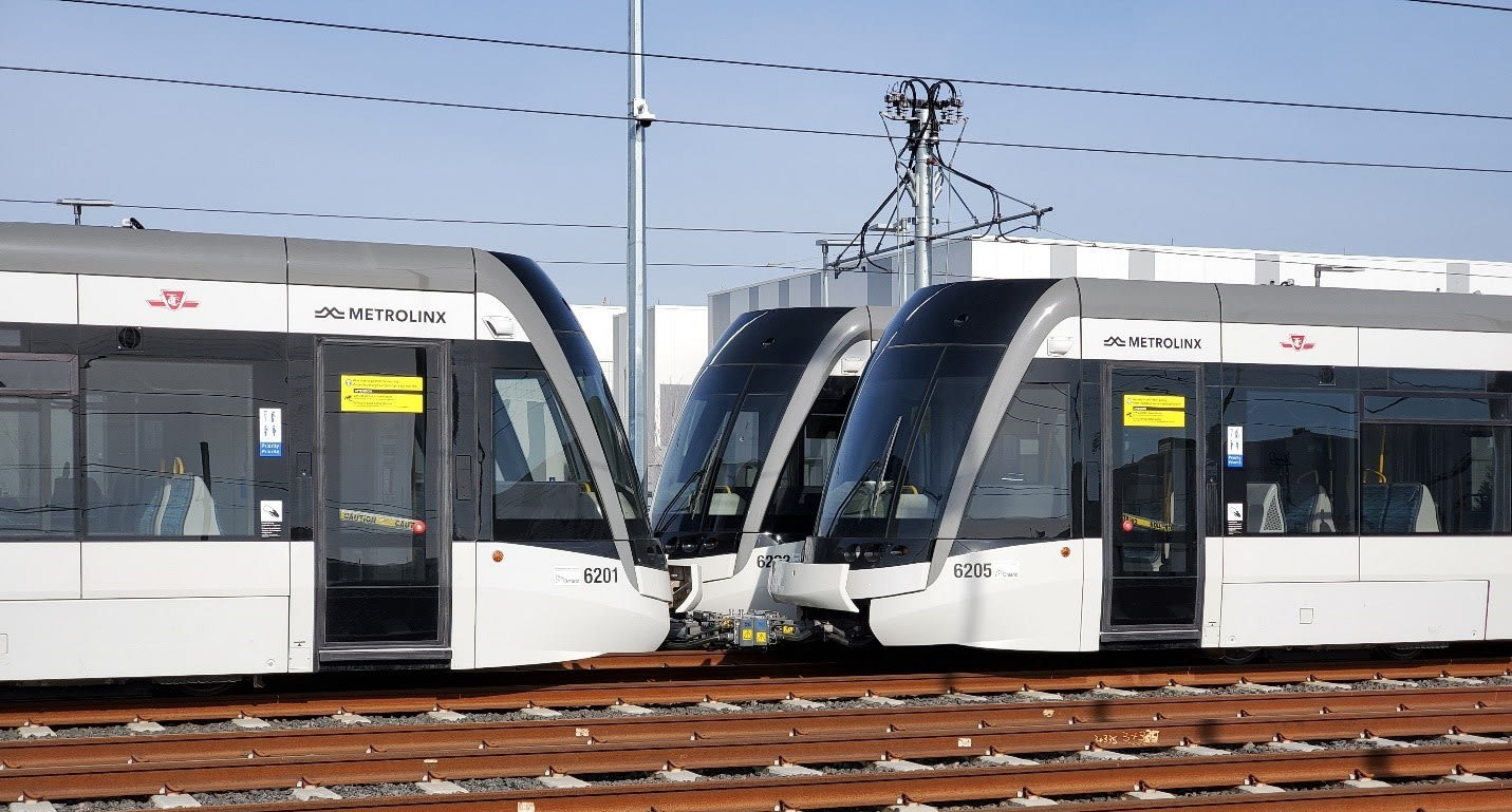 Two light rail vehicles are connected together.