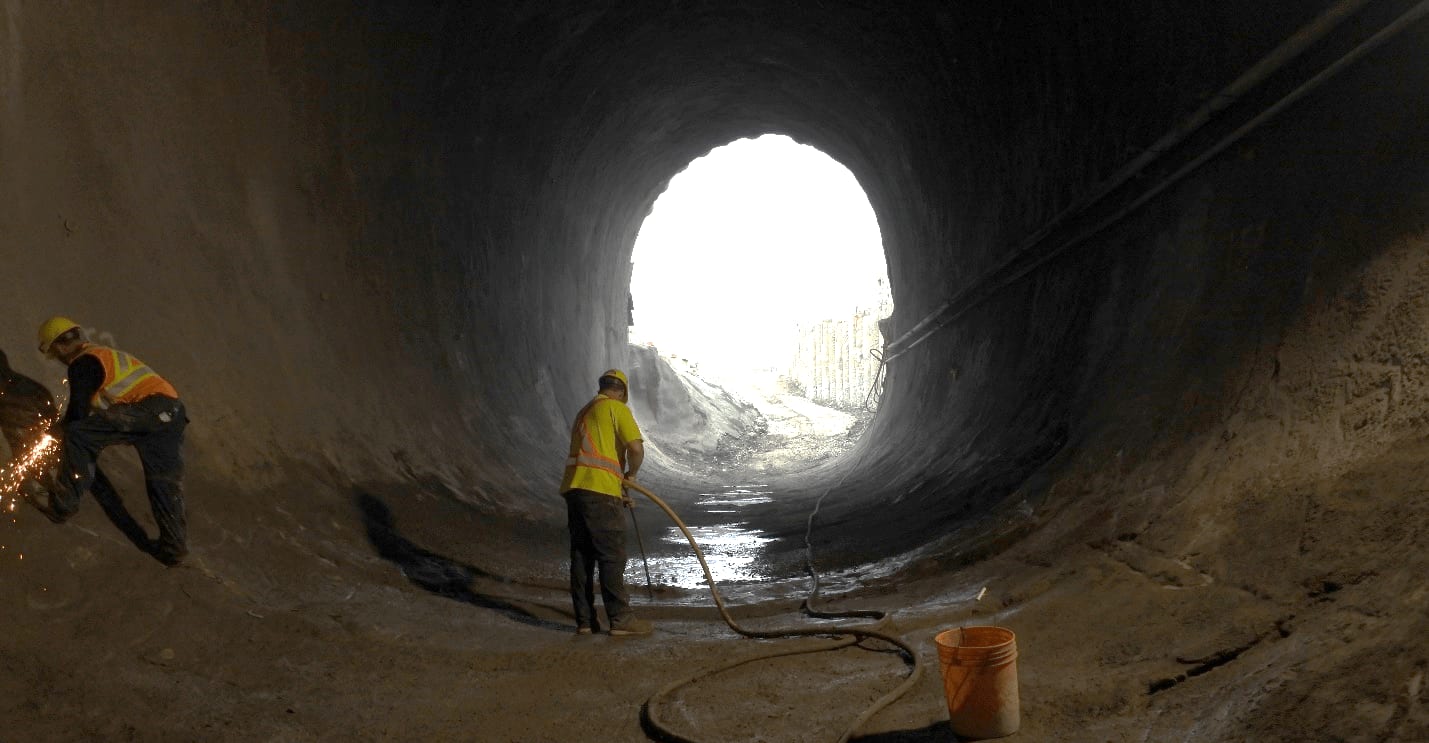 Crews work inside a tunnel.