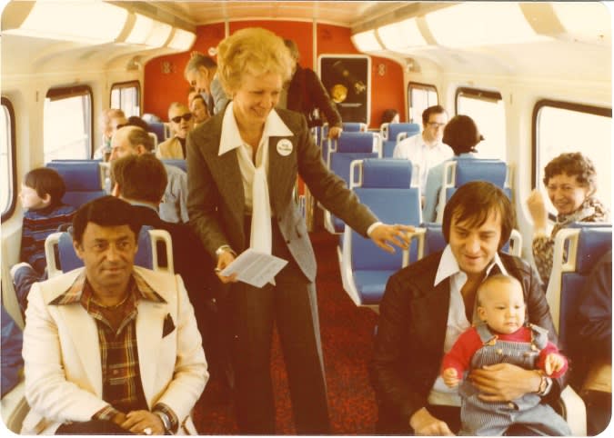 Passengers sit inside a GO train.