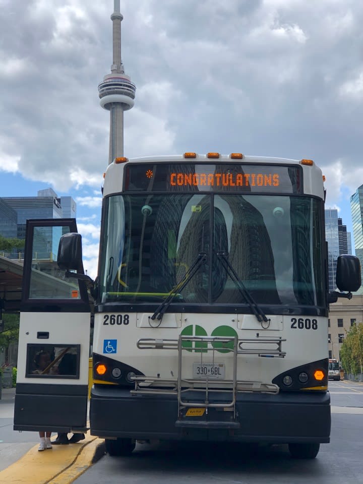 Couple takes wedding photos at GO Bus terminal