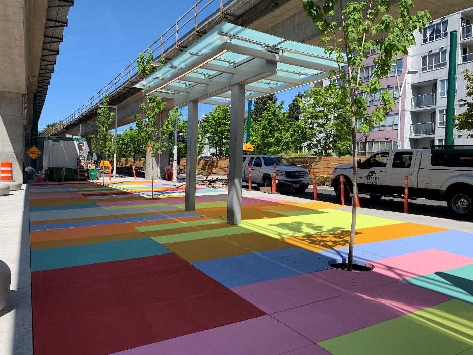 a sidewalk with colourful squares.
