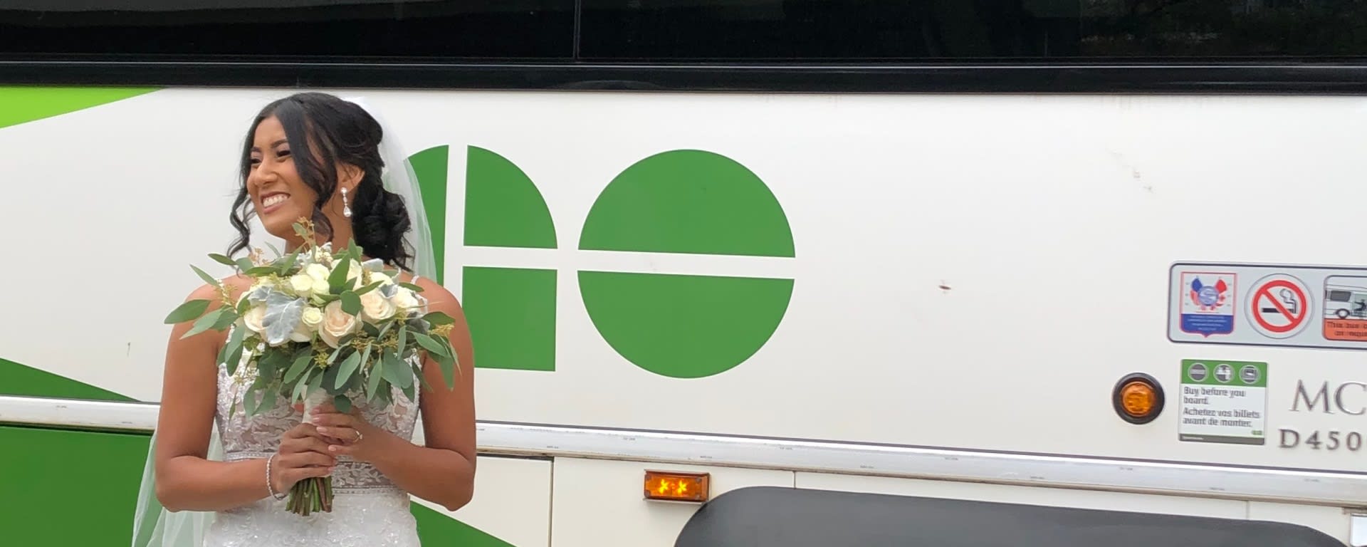 Couple takes wedding photos at GO Bus terminal