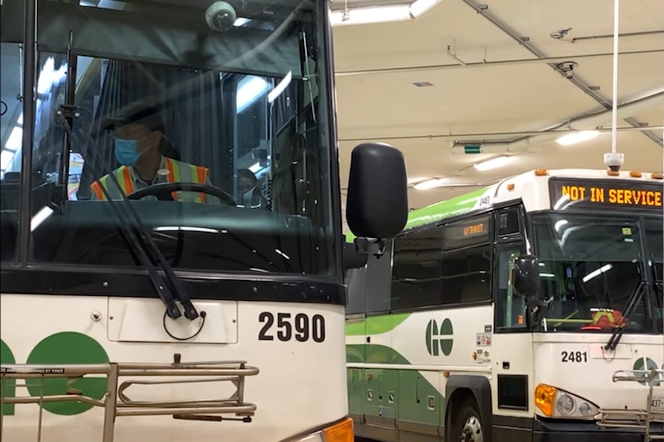 Buses sit parked.