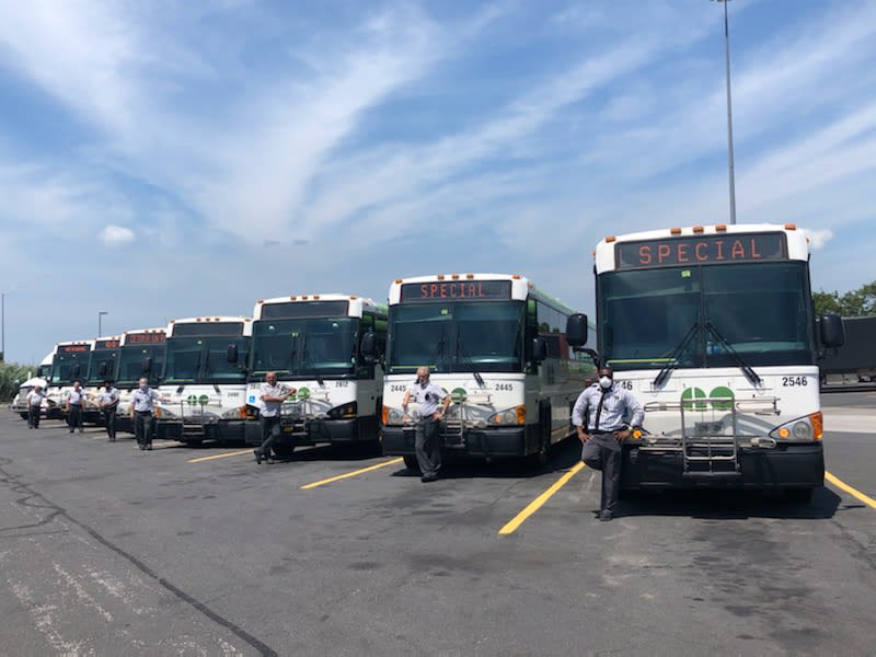 The GO convoy of buses and drives pose ready to depart for Windsor from the Mississauga GO bus de...