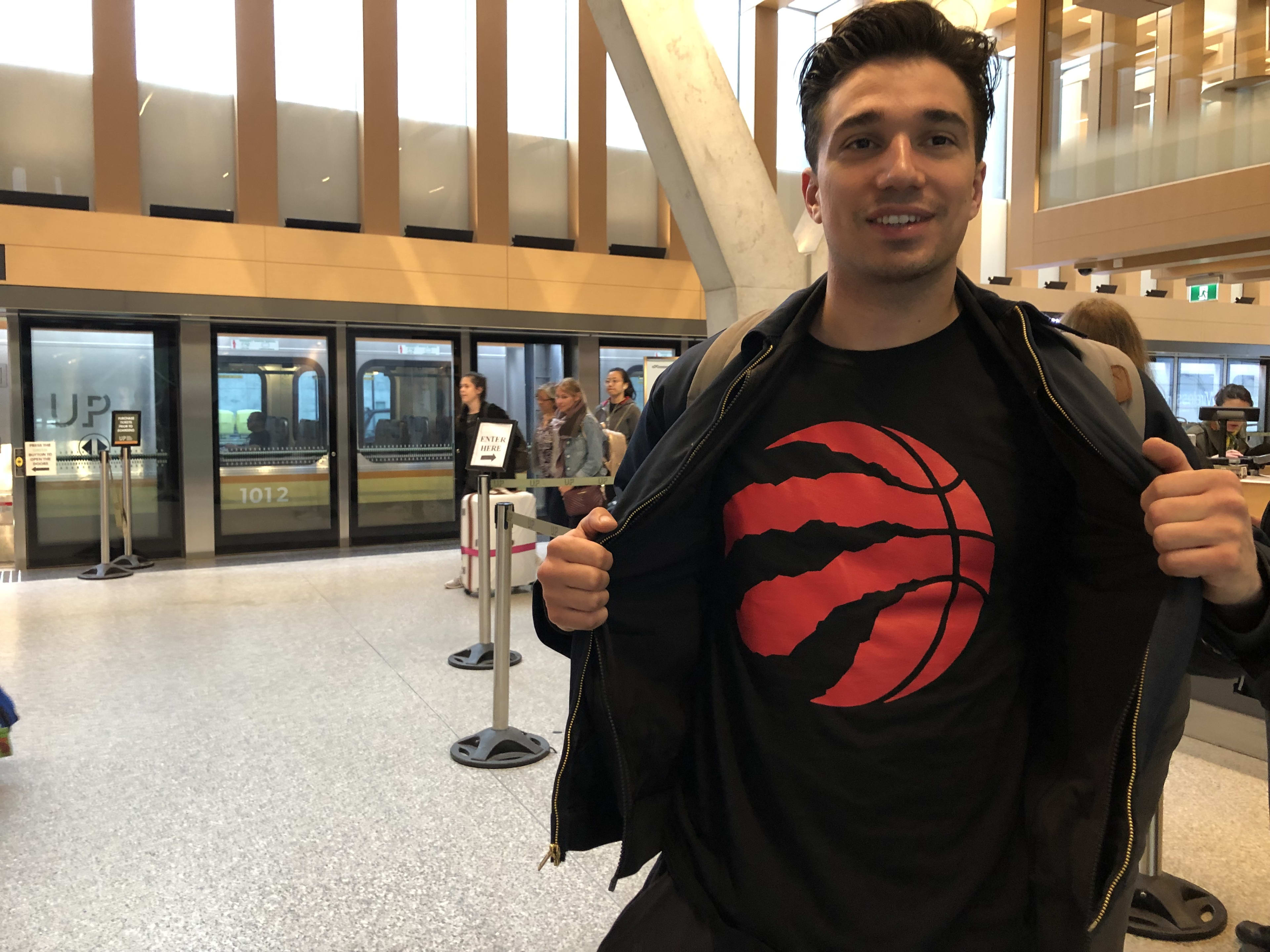 Mike DaCosta â?? a newborn Raptors fan â?? is shown after arriving at the UP Express station at...