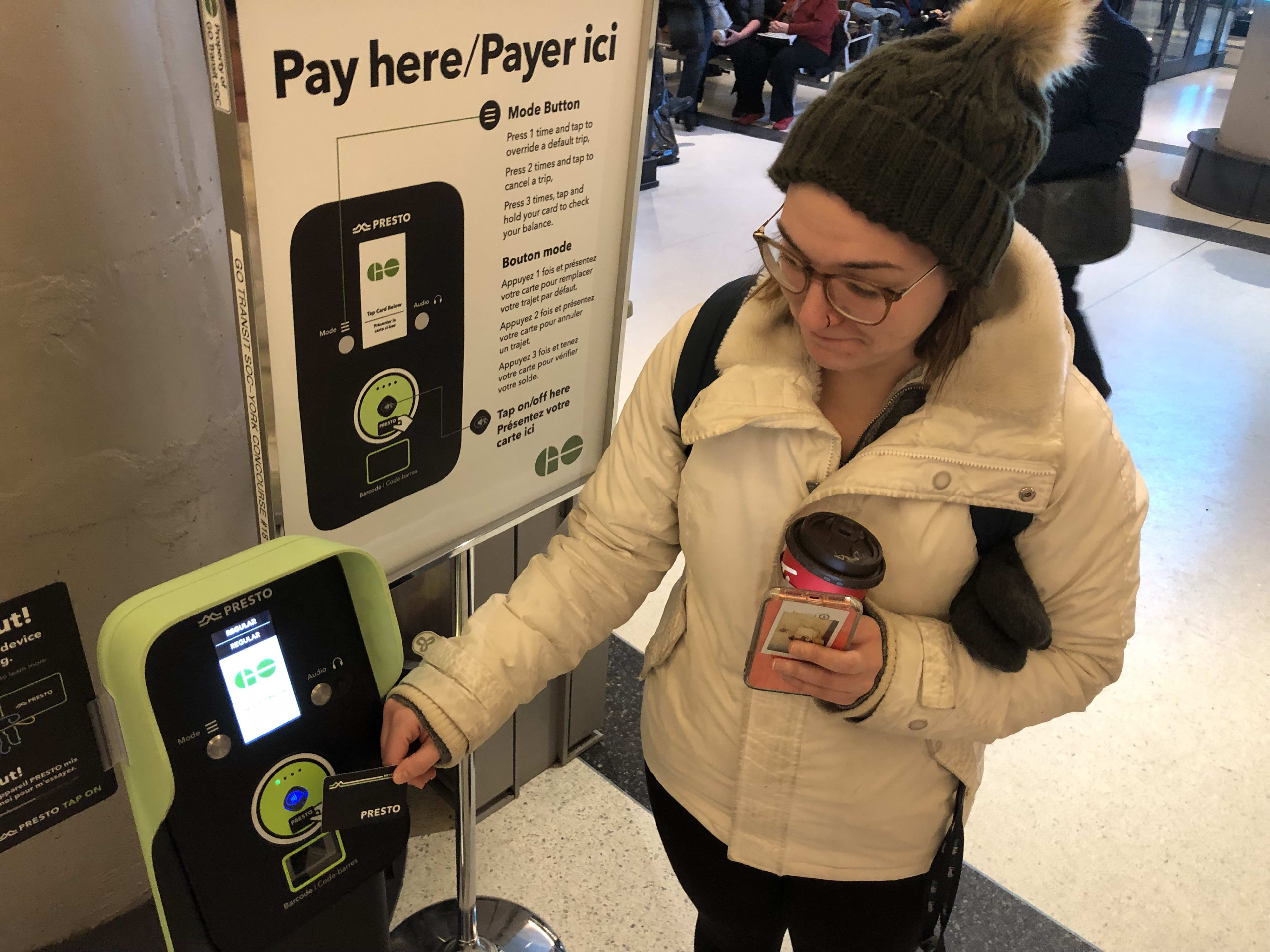 Erica tapping her PRESTO card.