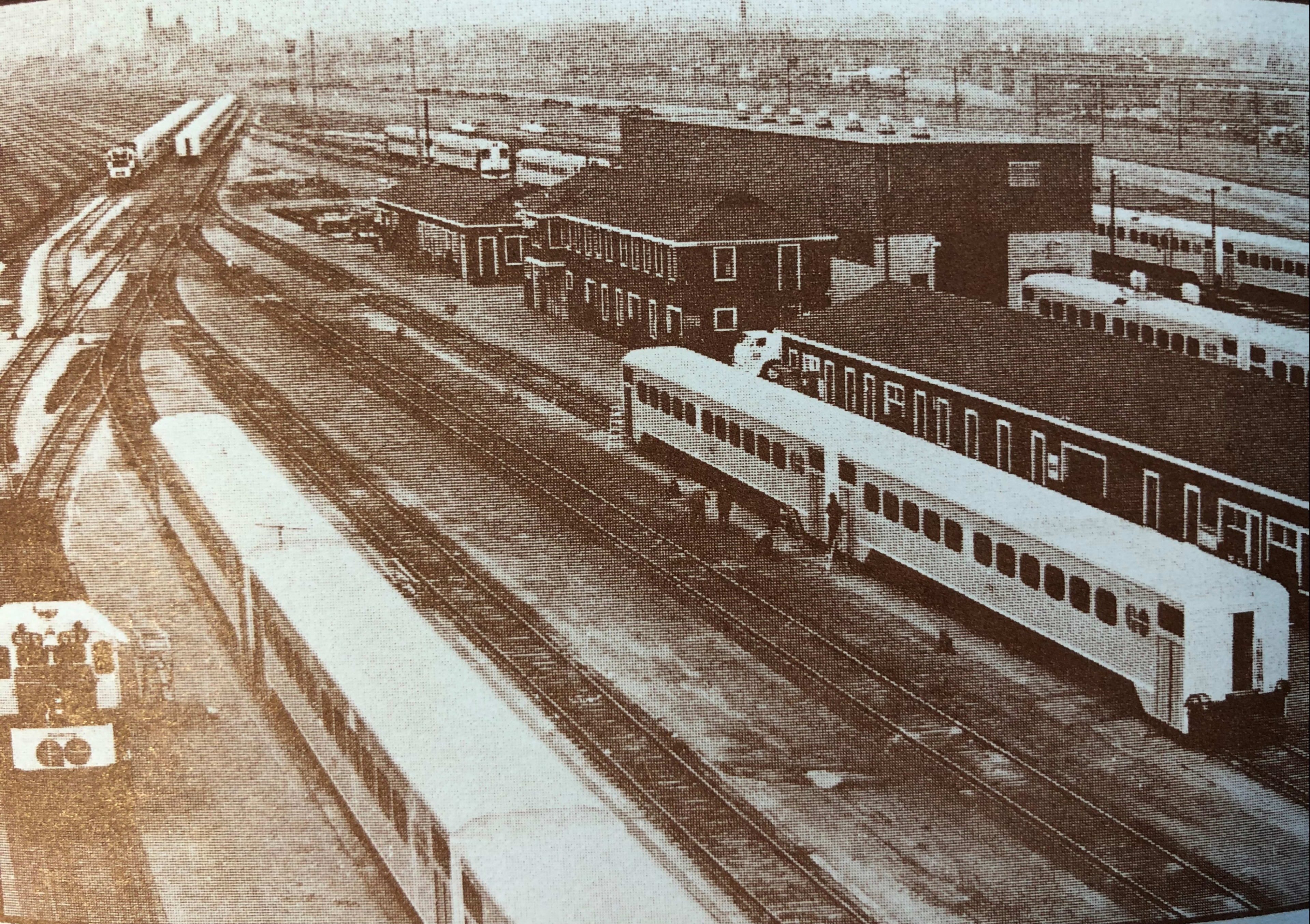 Historical trains sitting in the rail yard.