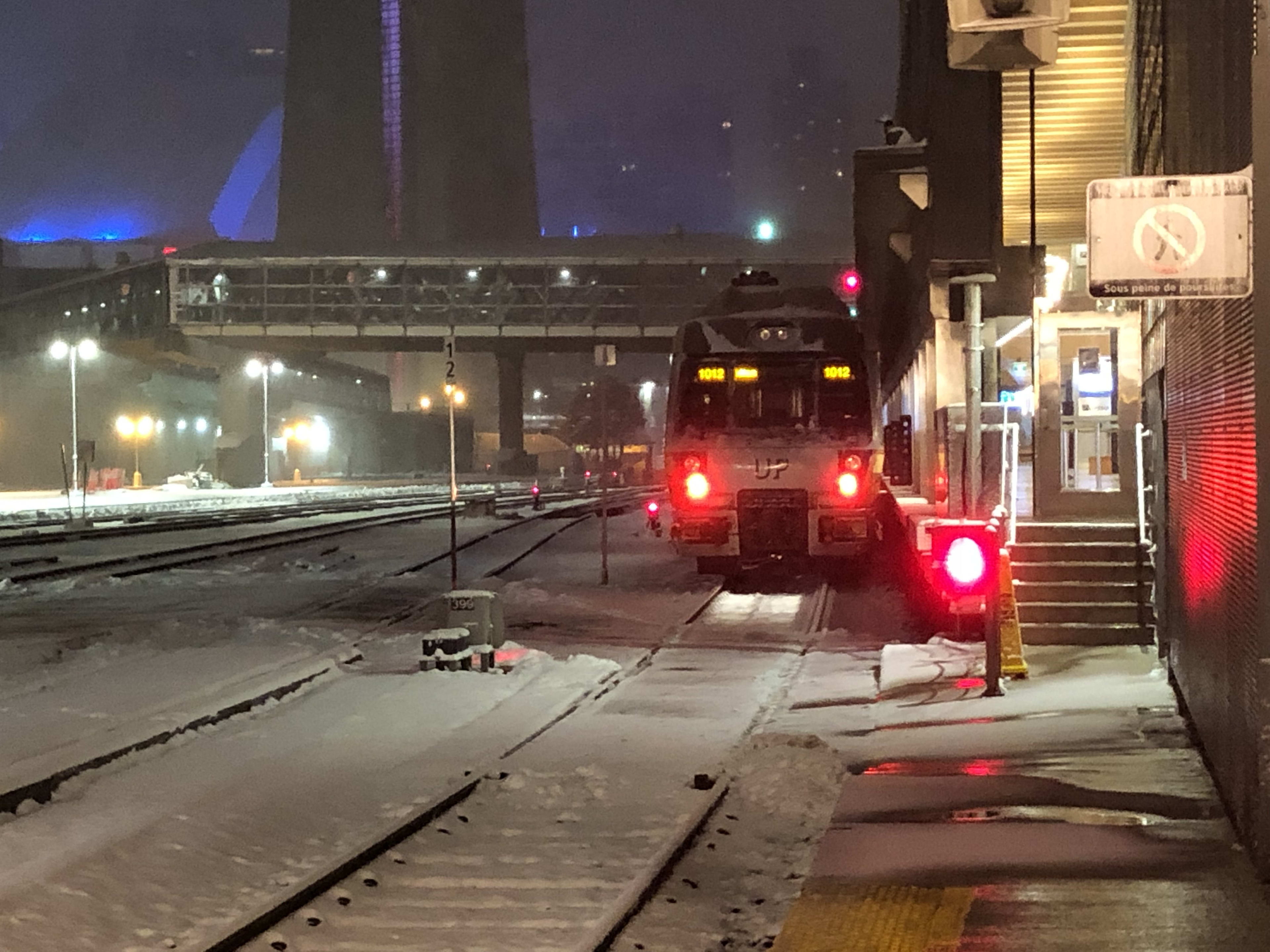 an UP Express train waiting at the platform.