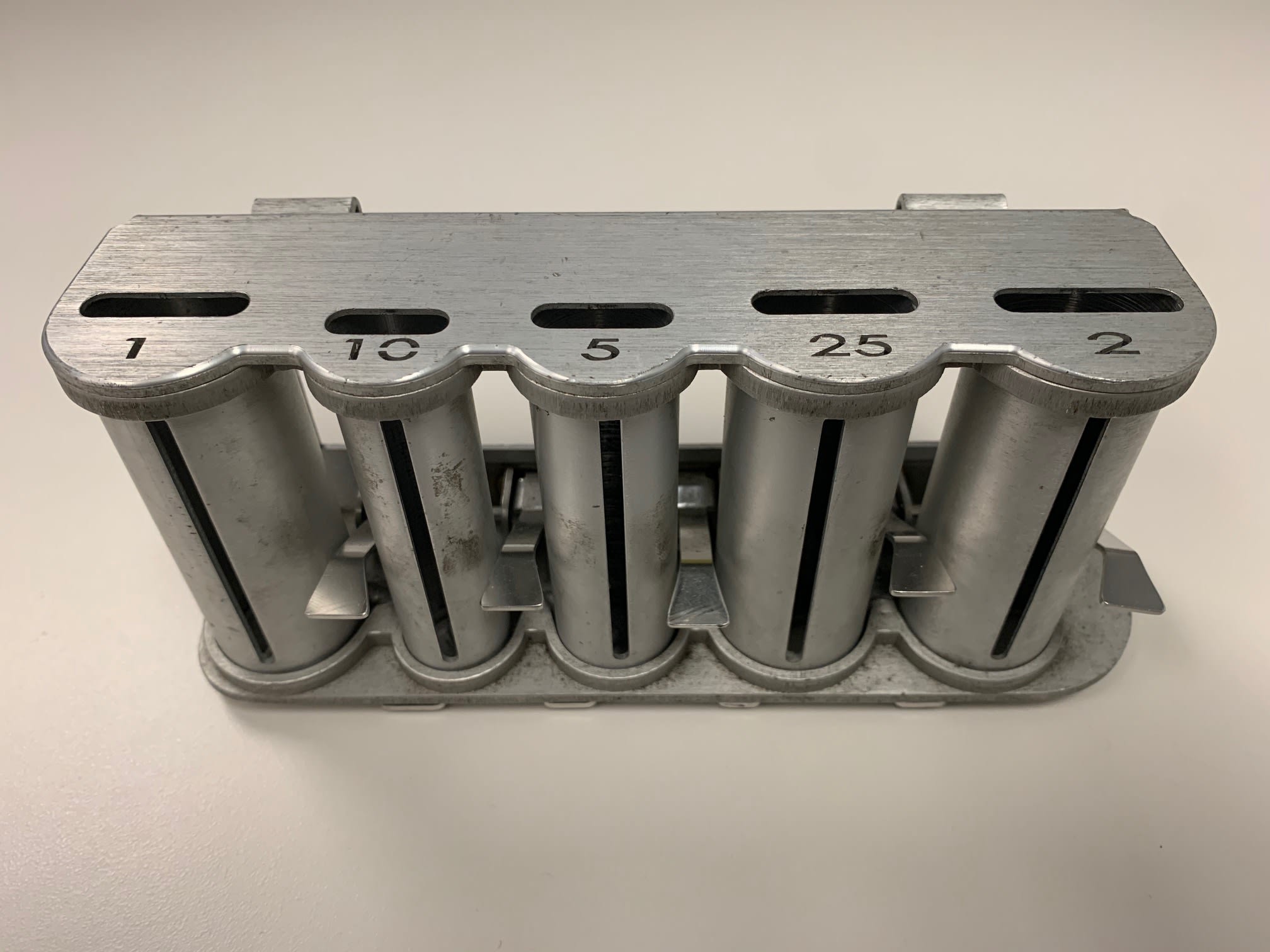 a new model coin dispenser with slots for all of the Canadian currency