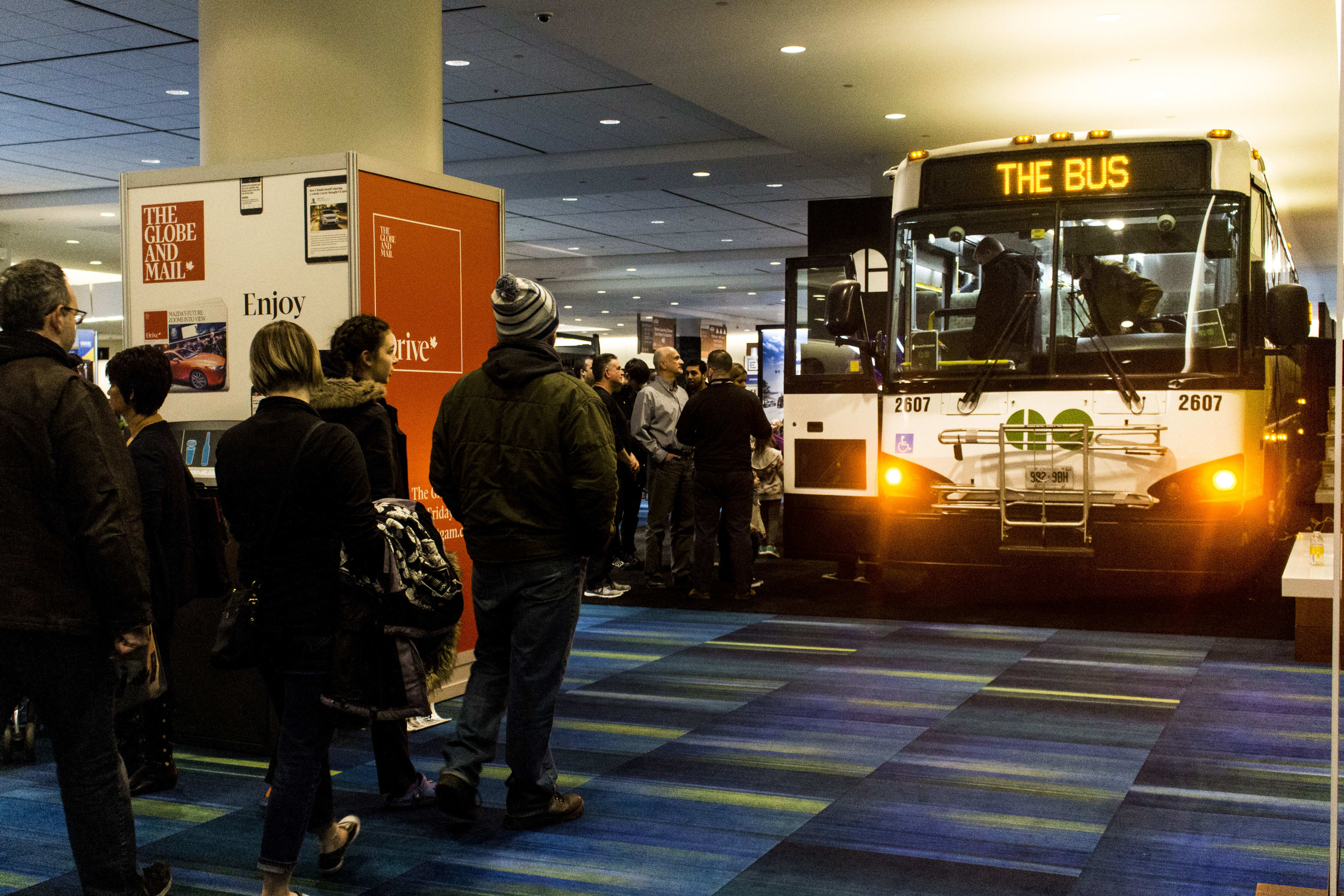 Crowds line up to see inside the GO bus at the International AutoShow.