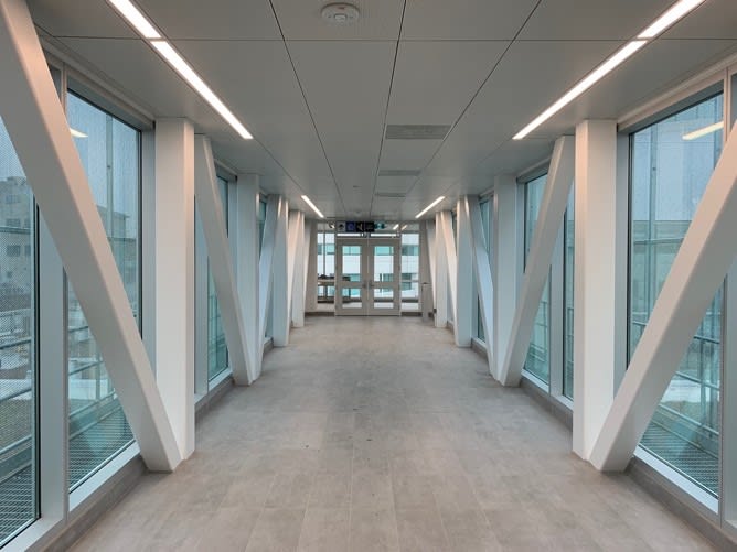 The view inside the glass and metal bridge.