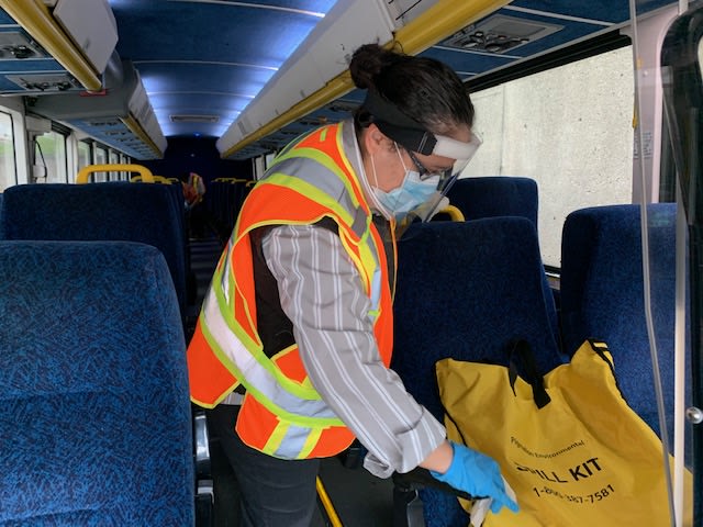 Staff cleaning GO buses