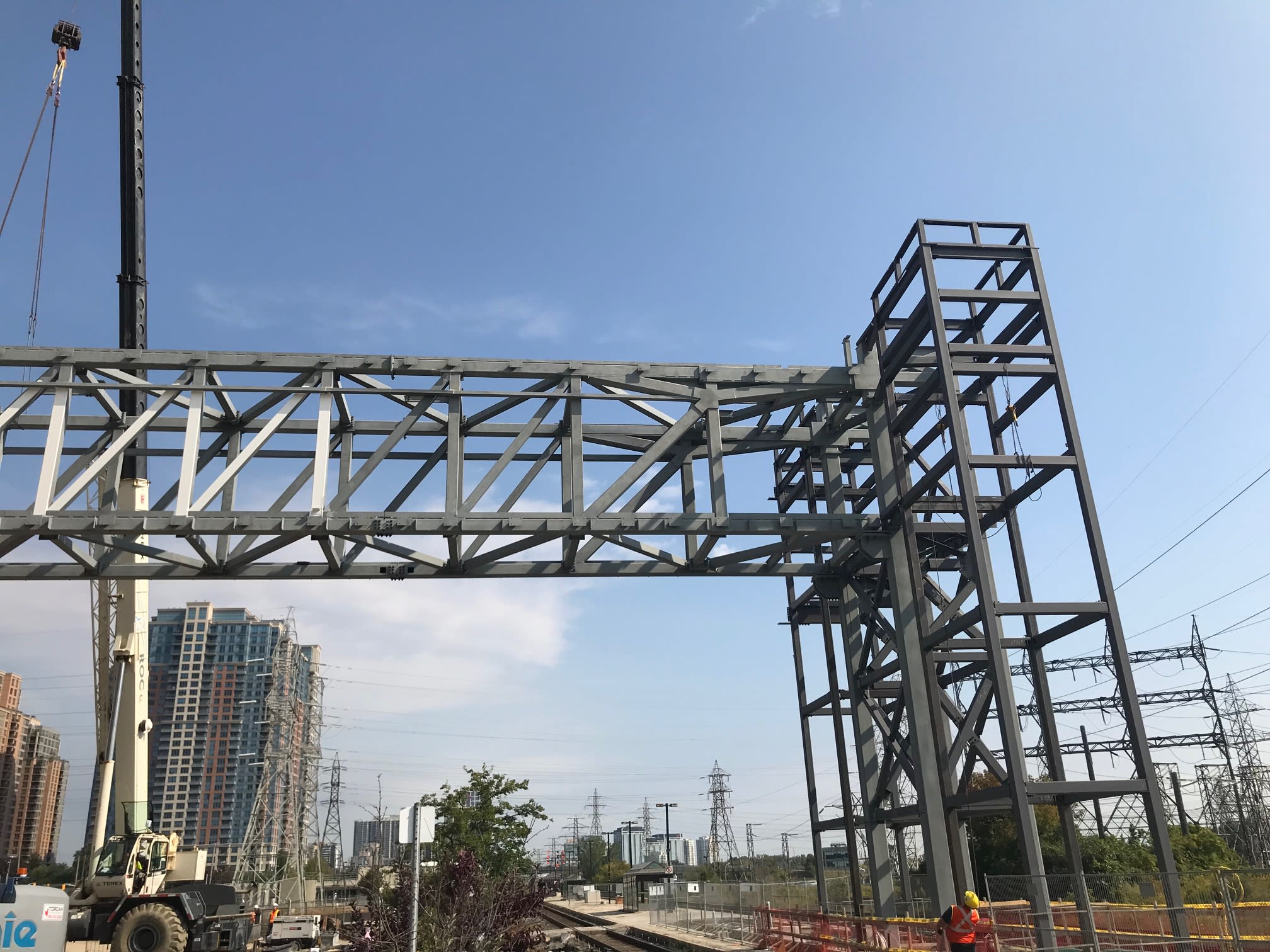 A closeup of the metal structure bridge over the tracks