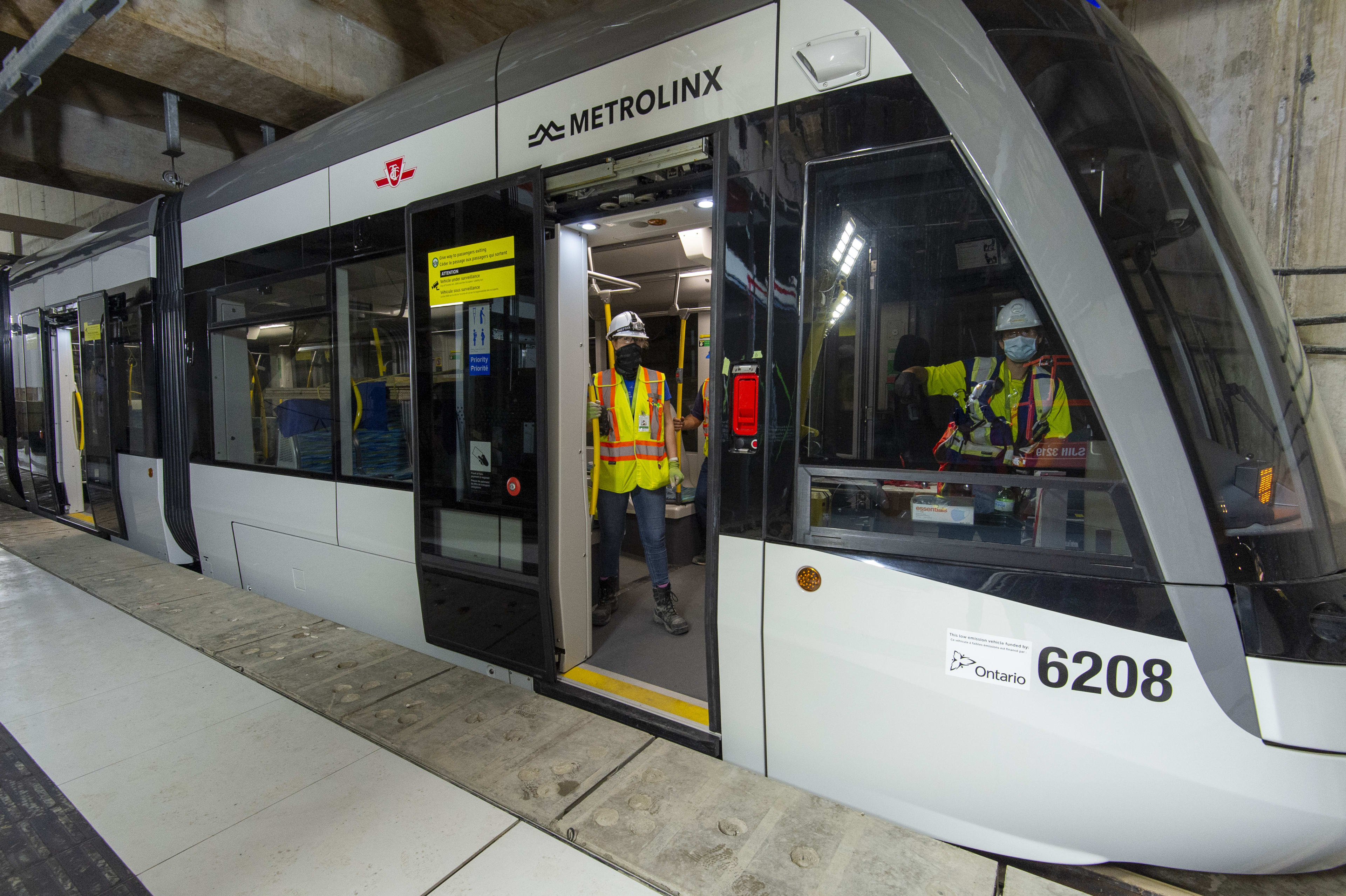 Crews sit in the parked light rail vehicle at Caledonia Station as part of recent testing