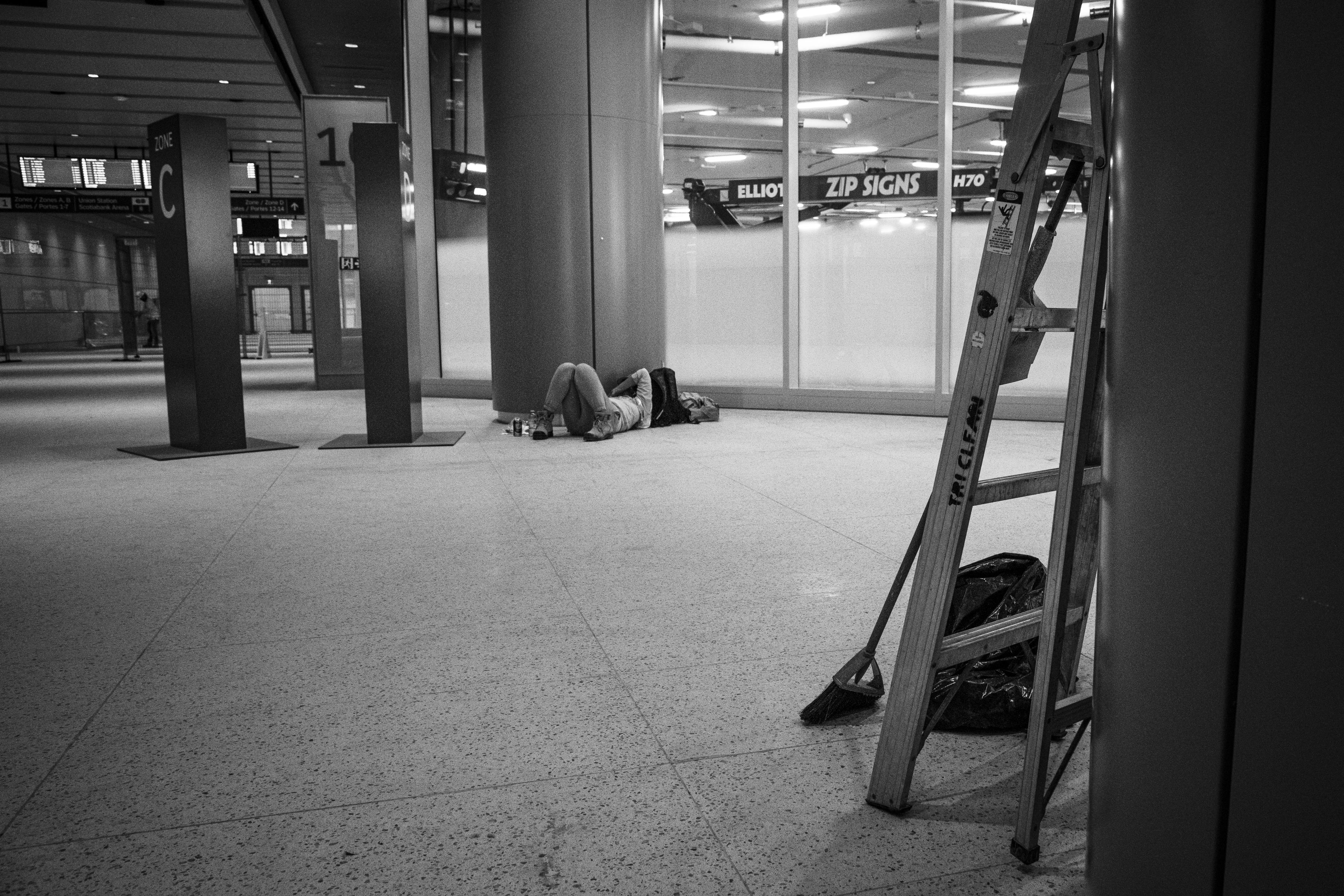 A worker relaxes on the floor.