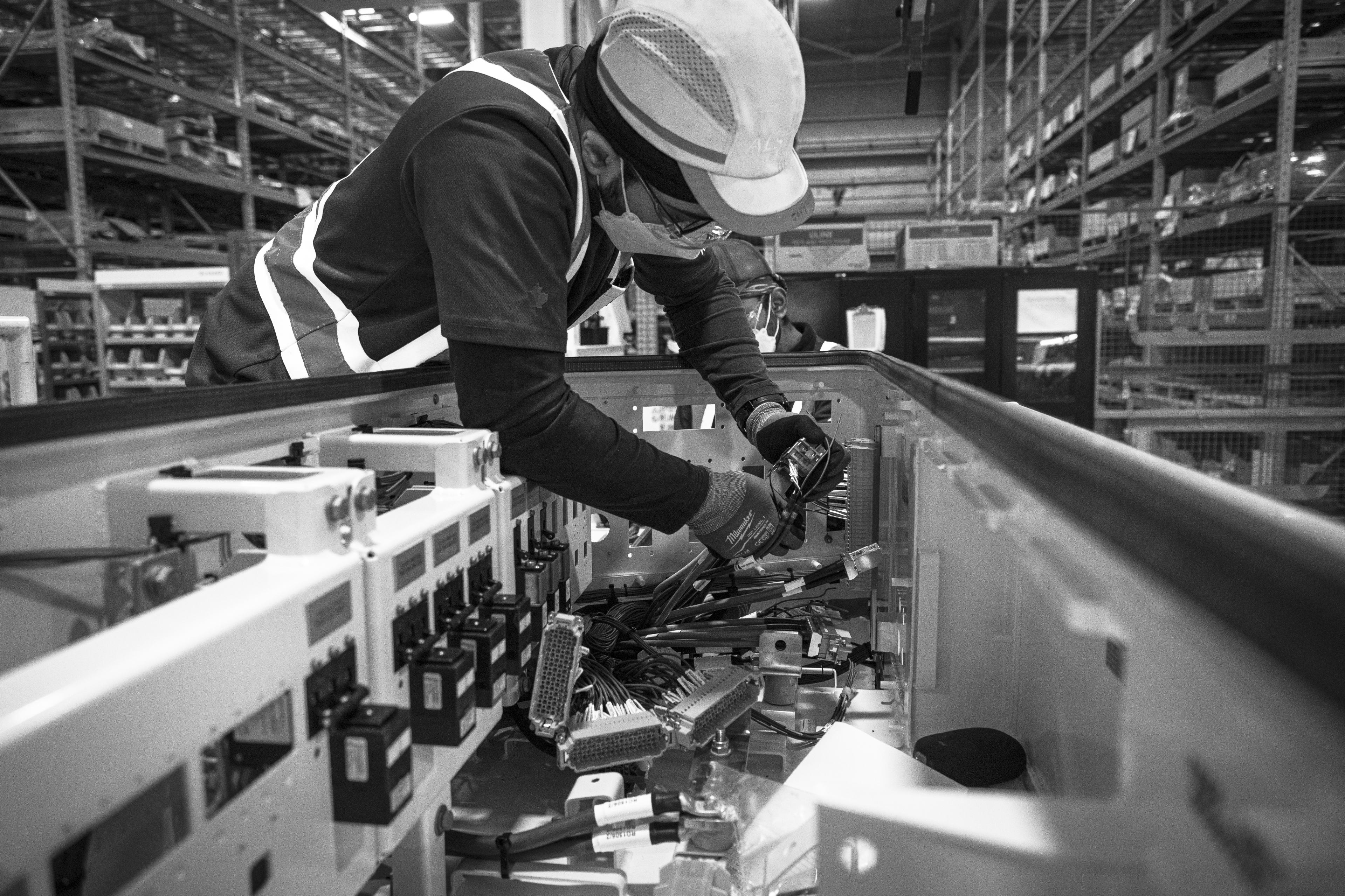 A man sorts through wires.