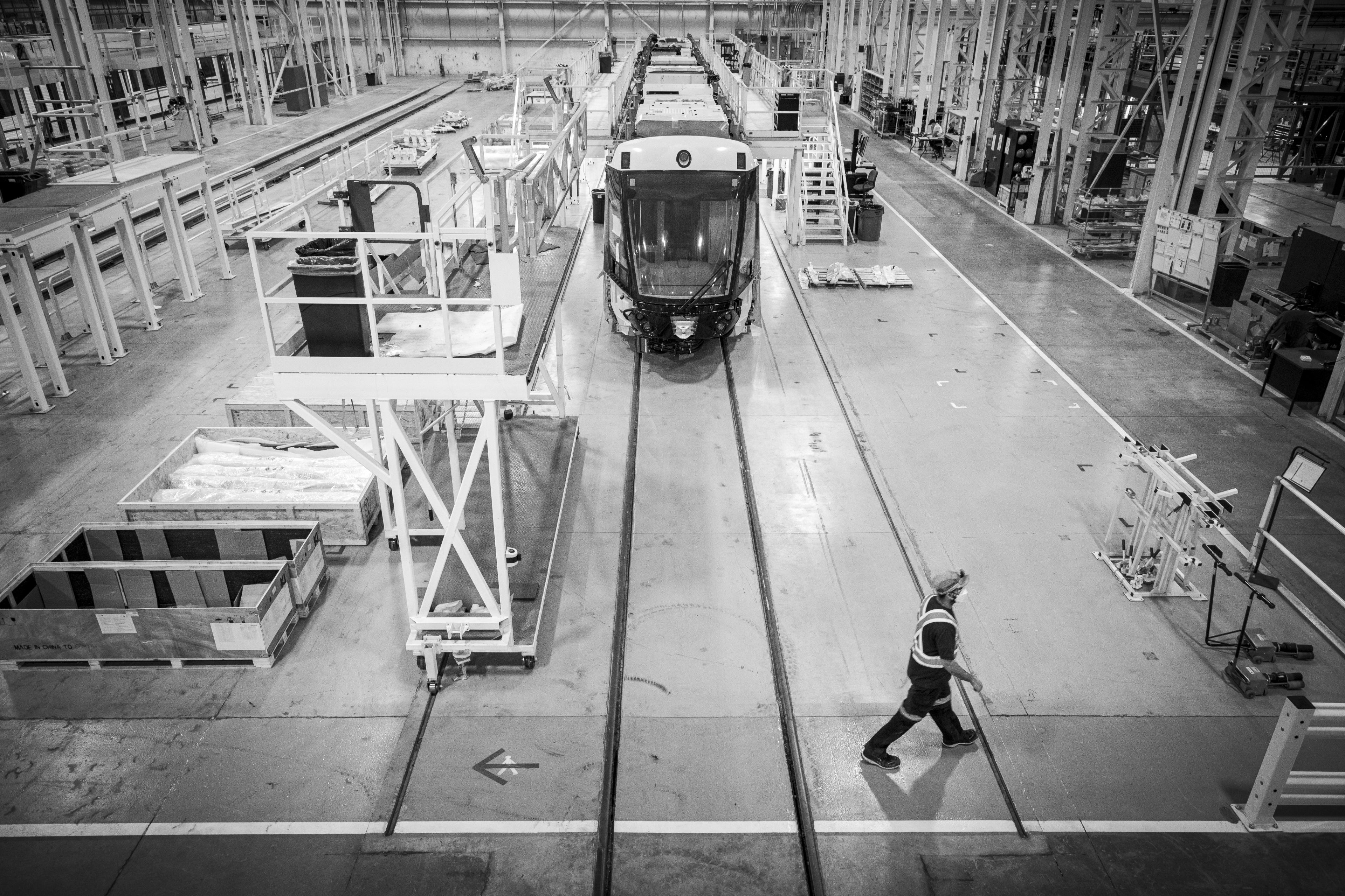 A man walks across the shop floor.