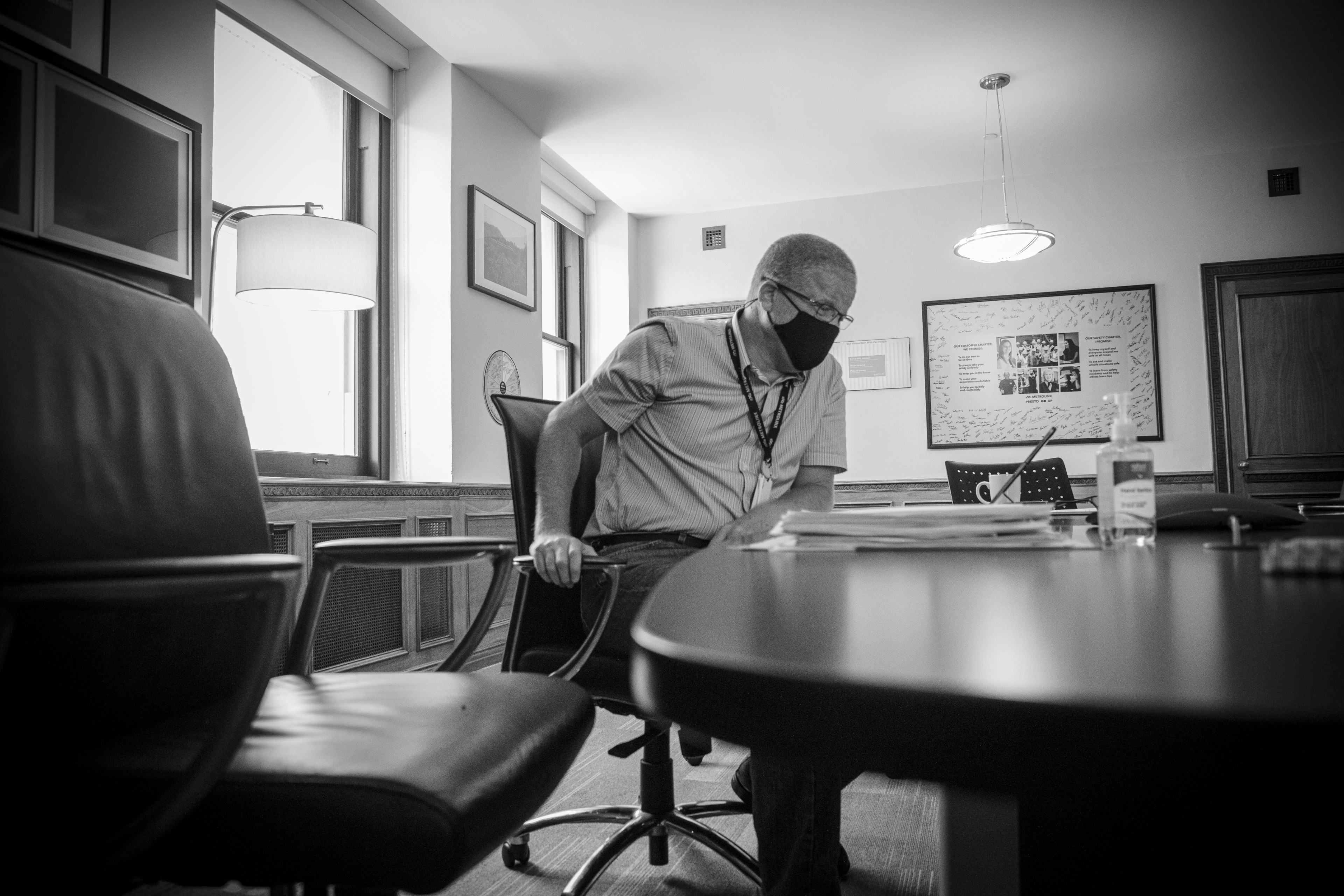 Phil Verster is seen at his desk.