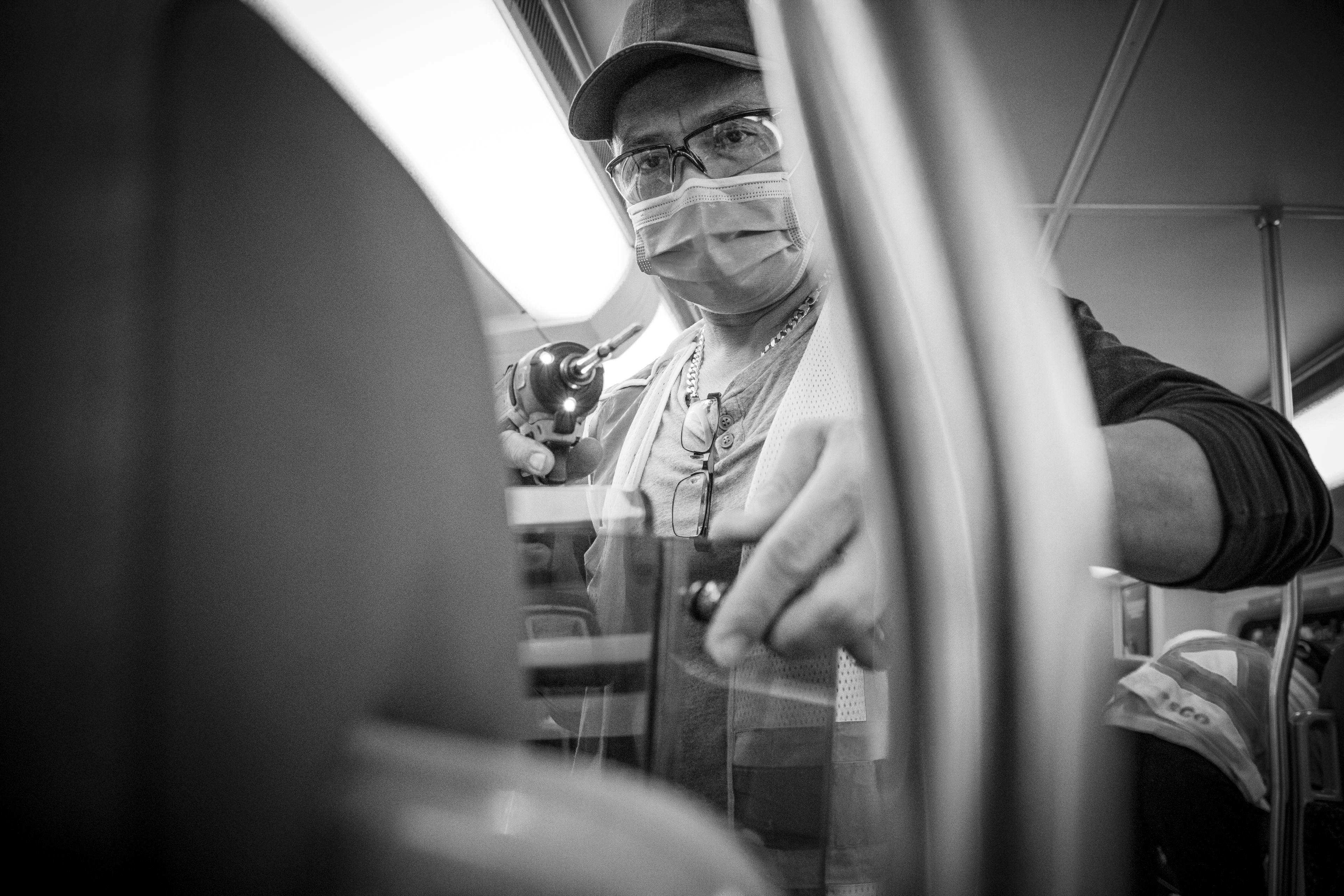 A man installs a barrier.