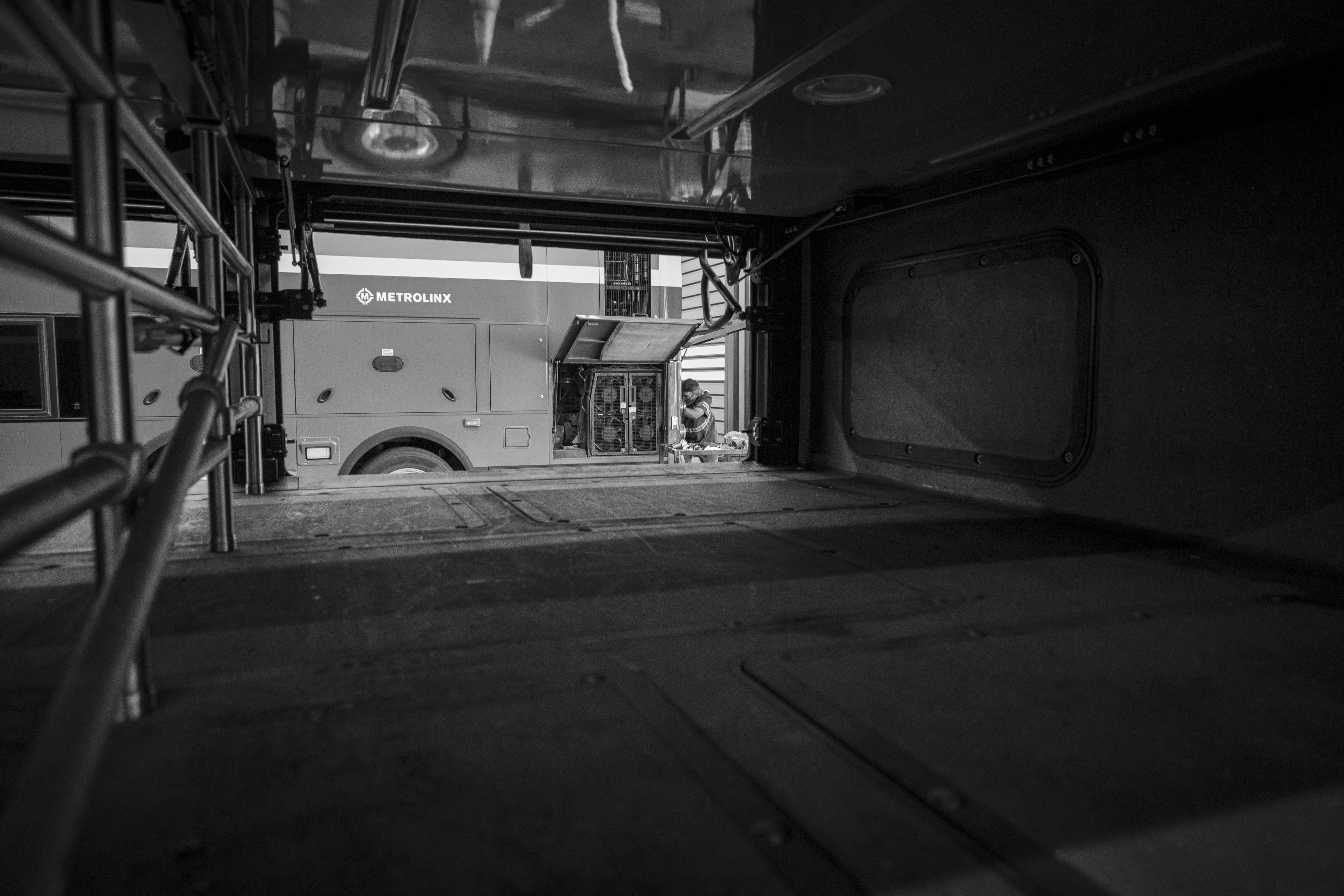 a man working on a bus.