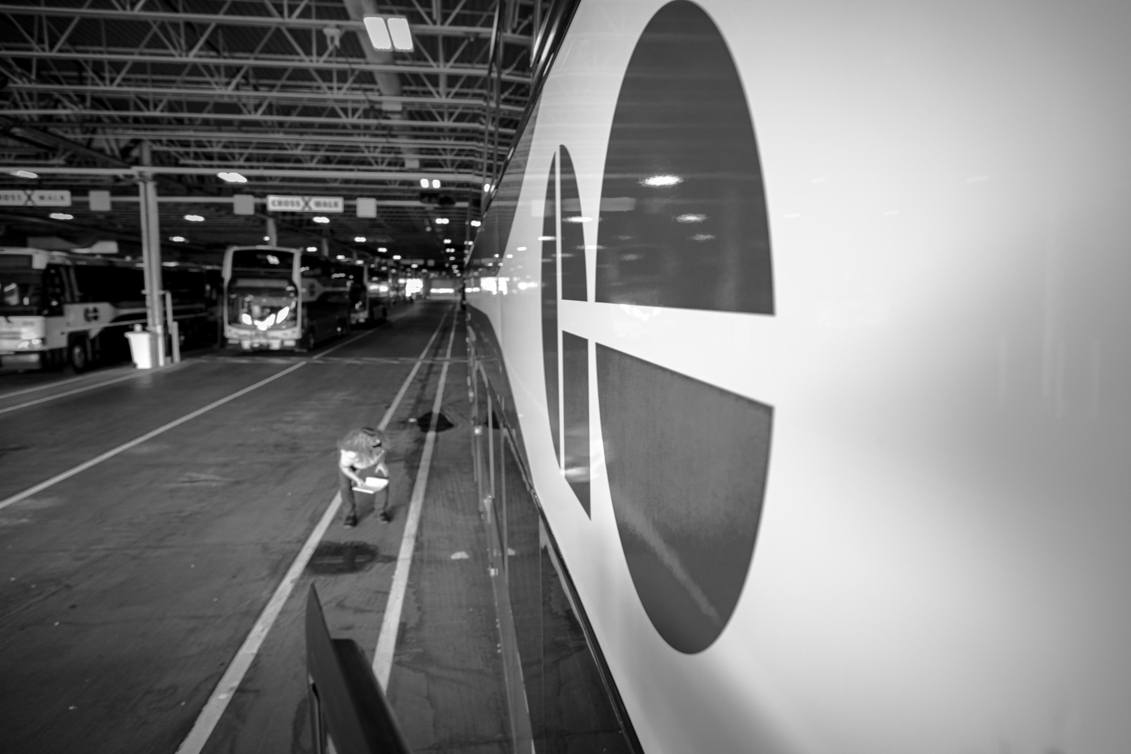 A woman checks out a bus.
