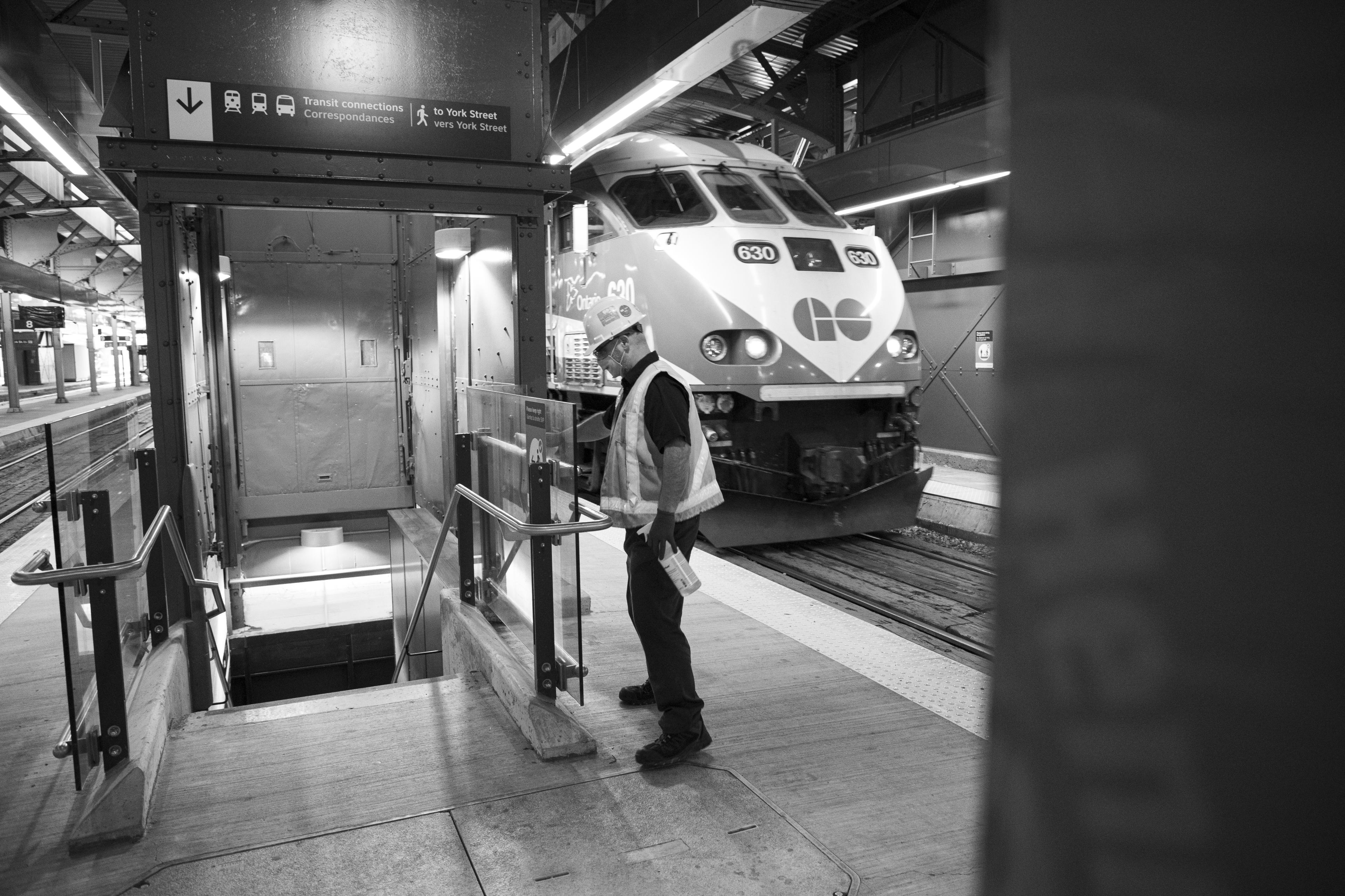 A man cleans on a platform.
