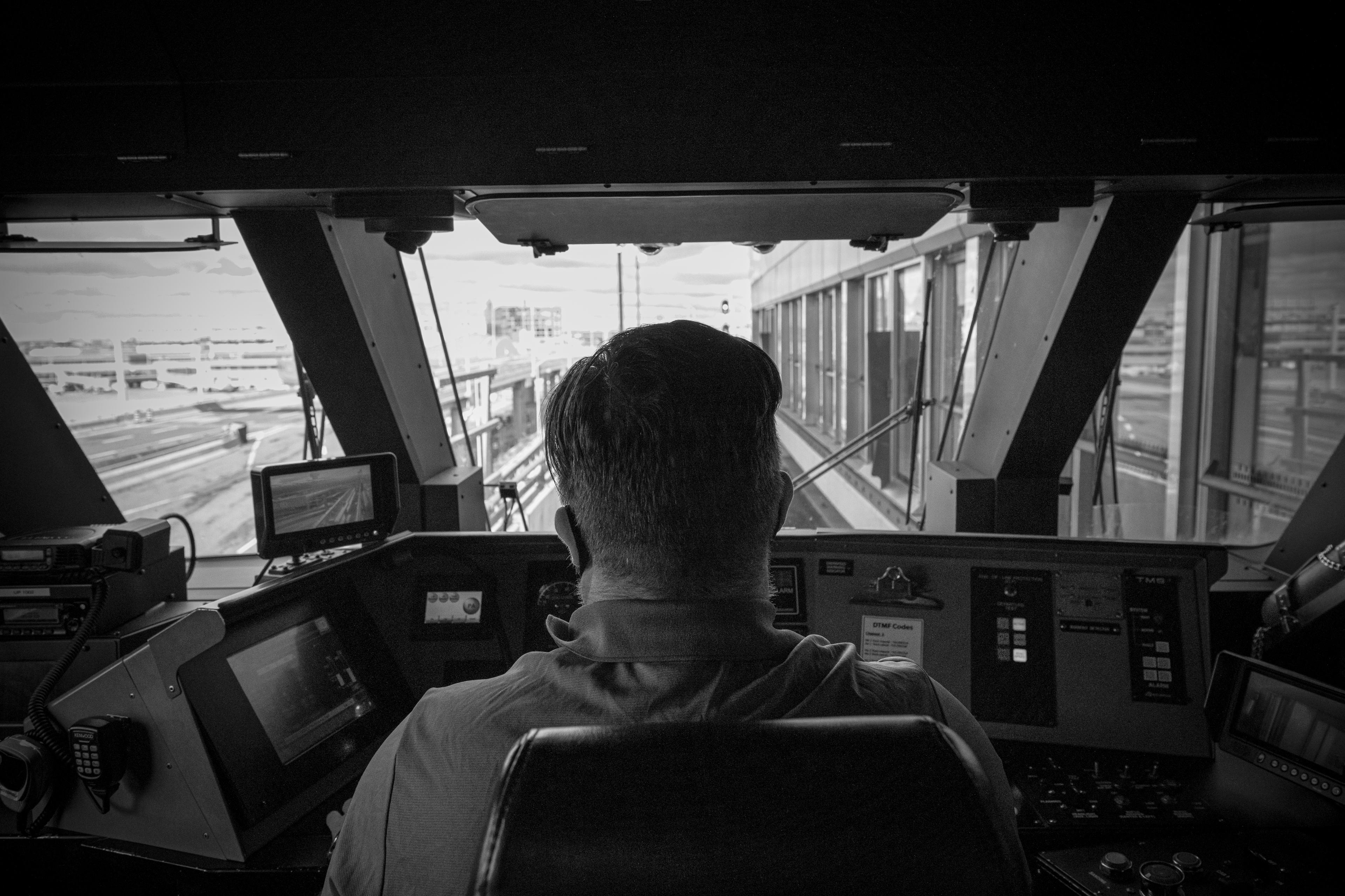 A man sits at the controls of an UP vehicle.