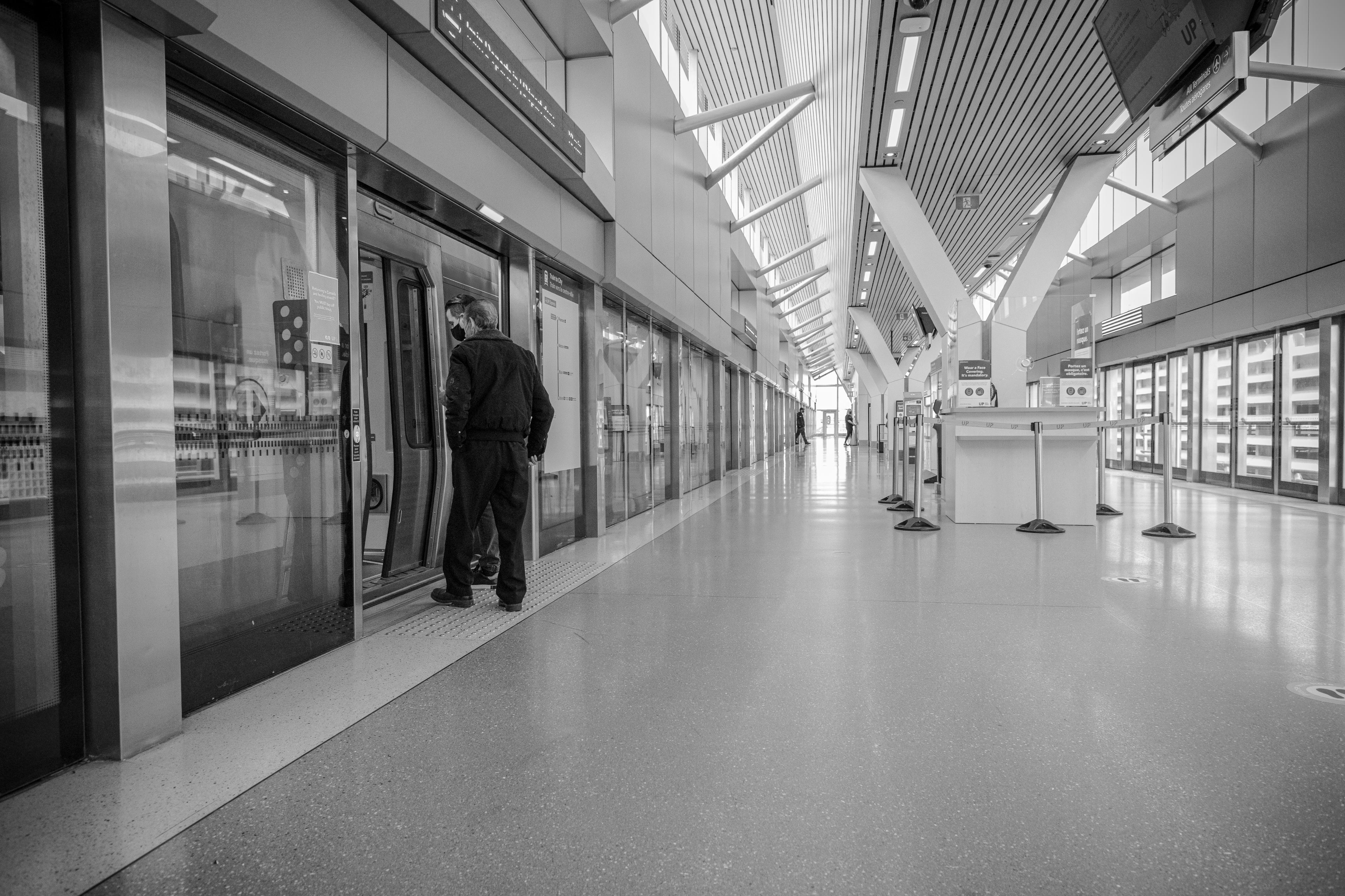 A man walks onto an UP train.